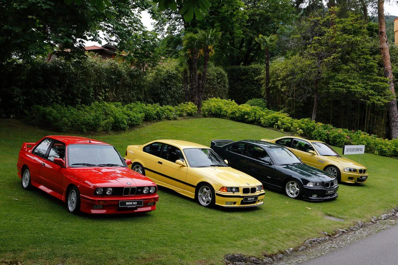 Red Yellow Green Bmw Collection Parked on Grass Lawn