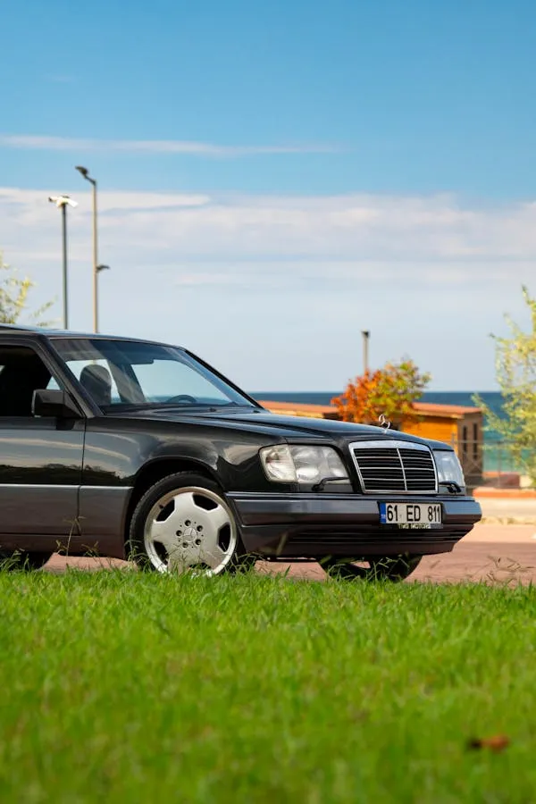Retro Mercedes Benz Sedan Parked by Lakeside Path Wallpaper