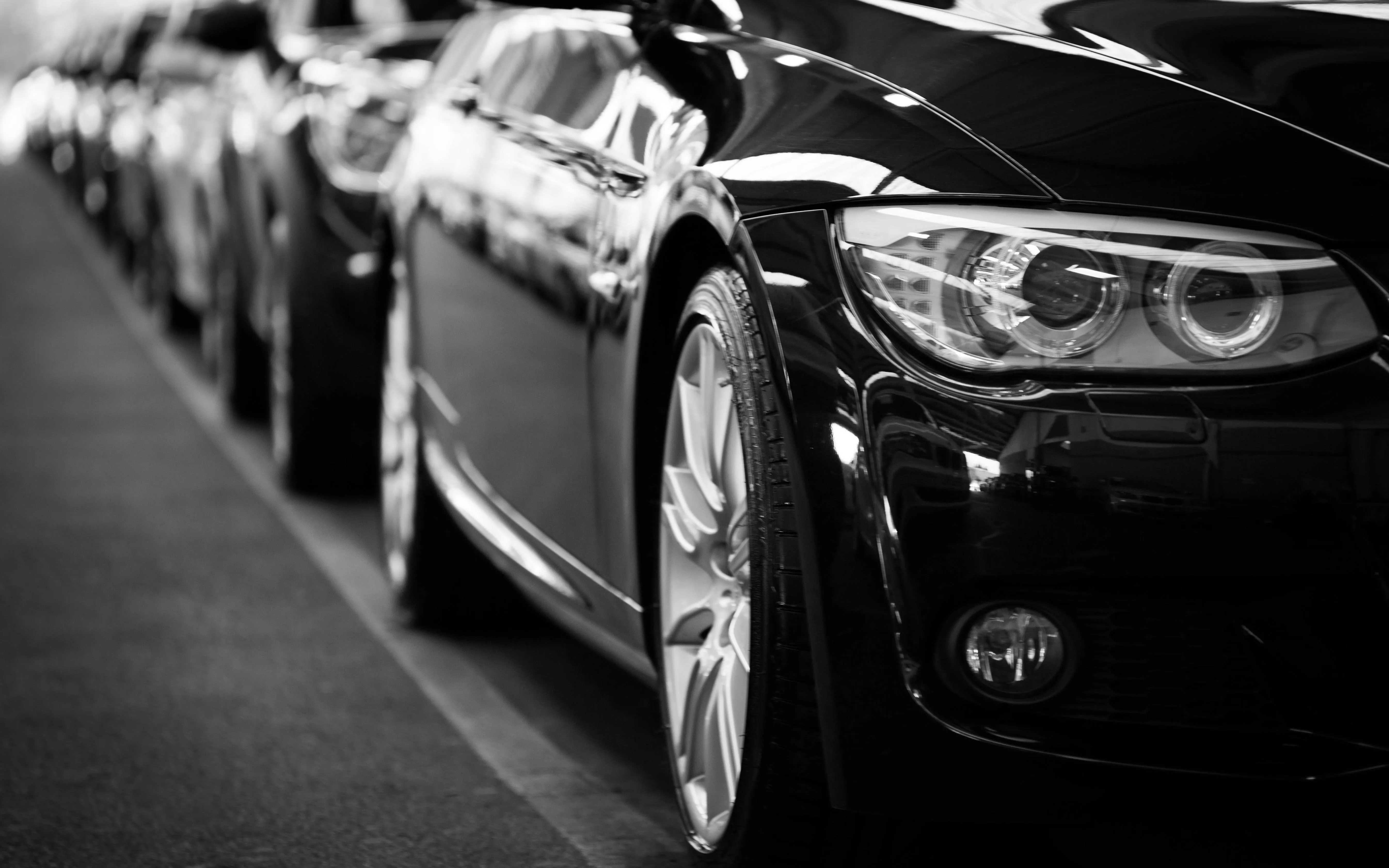 Row of Black Bmw Sedans Parked in Dealership Lot Wallpaper