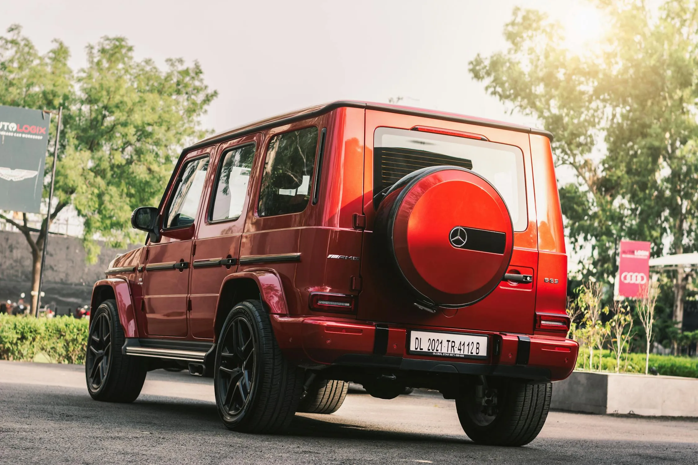 Rugged Red Mercedes G Wagon in Urban Area Wallpaper