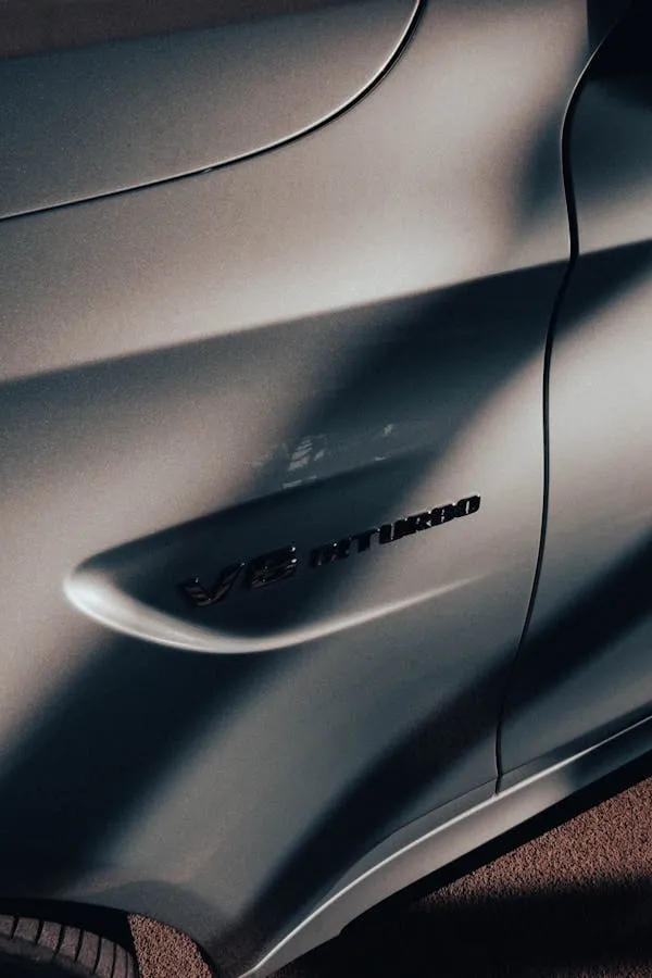 Side Emblem View of Mercedes AMG with Matte Finish Wallpaper