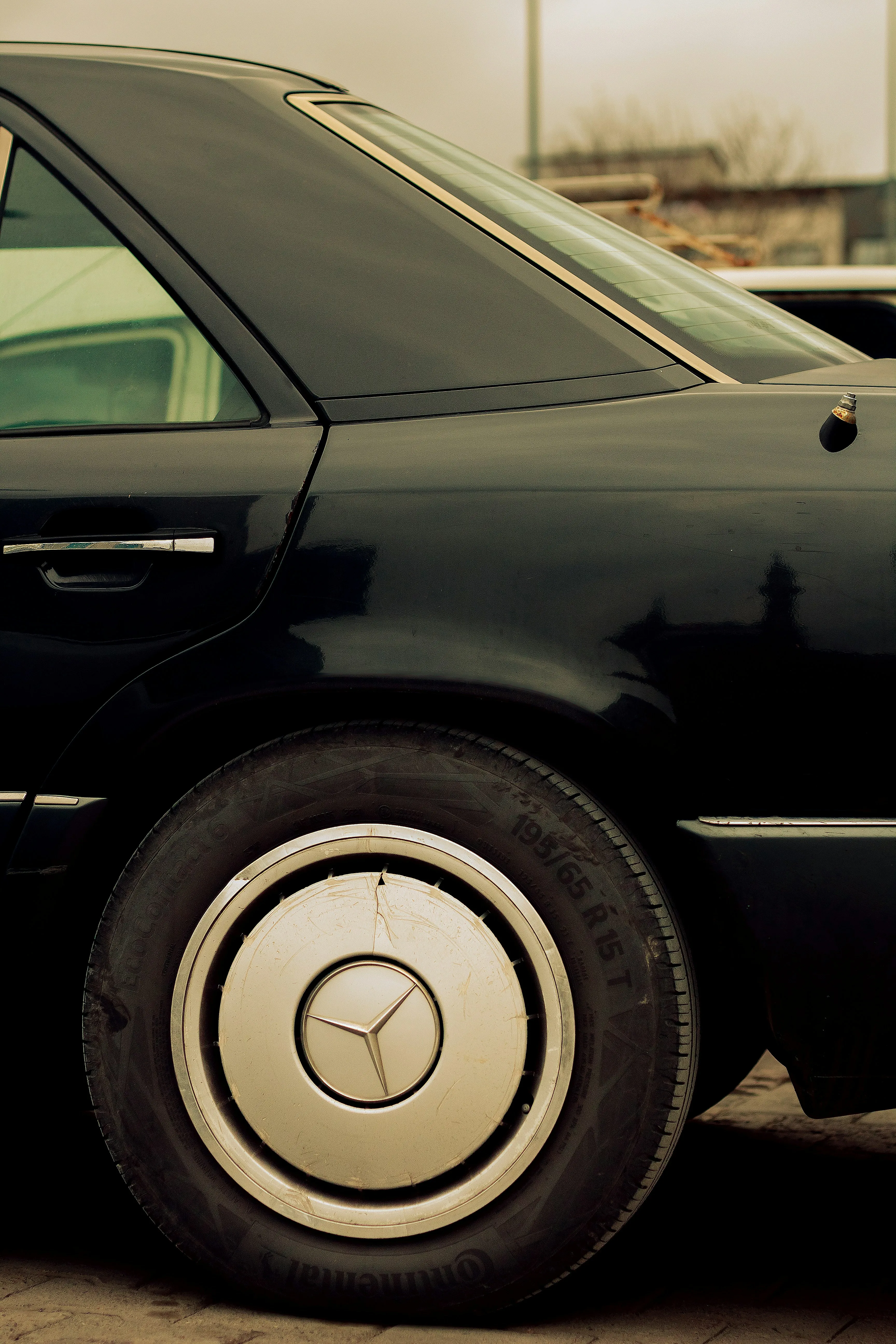 Side Profile Close Up of Vintage Mercedes Benz Wheel and Door