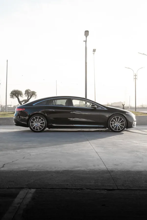 Side Profile of Black Mercedes Benz Sedan in Open Parking Lot