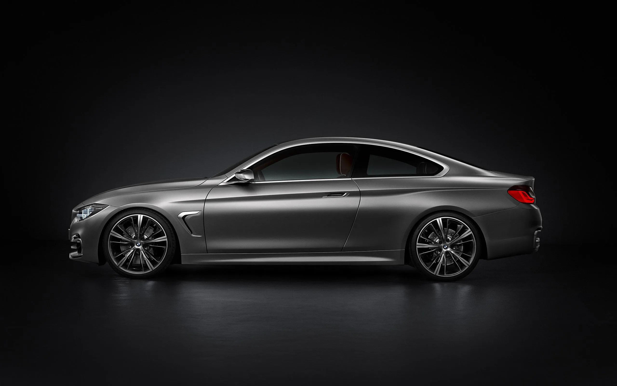 Side Profile of Sleek Bmw Coupe in Black Studio Light