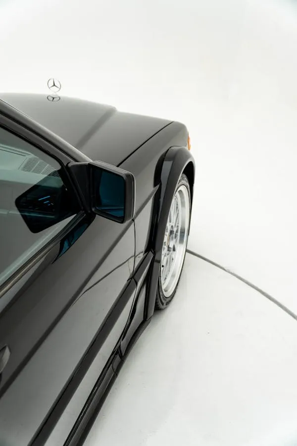 Side View of Black Mercedes Benz Coupe in White Studio
