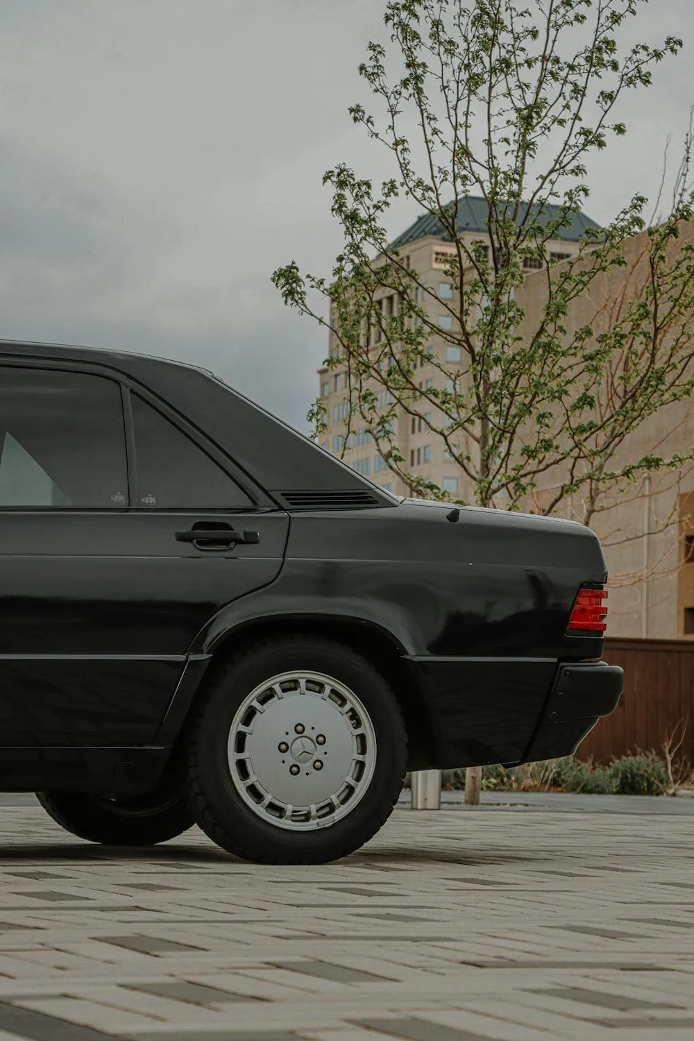 Side View of Black Vintage Mercedes Sedan on Driveway