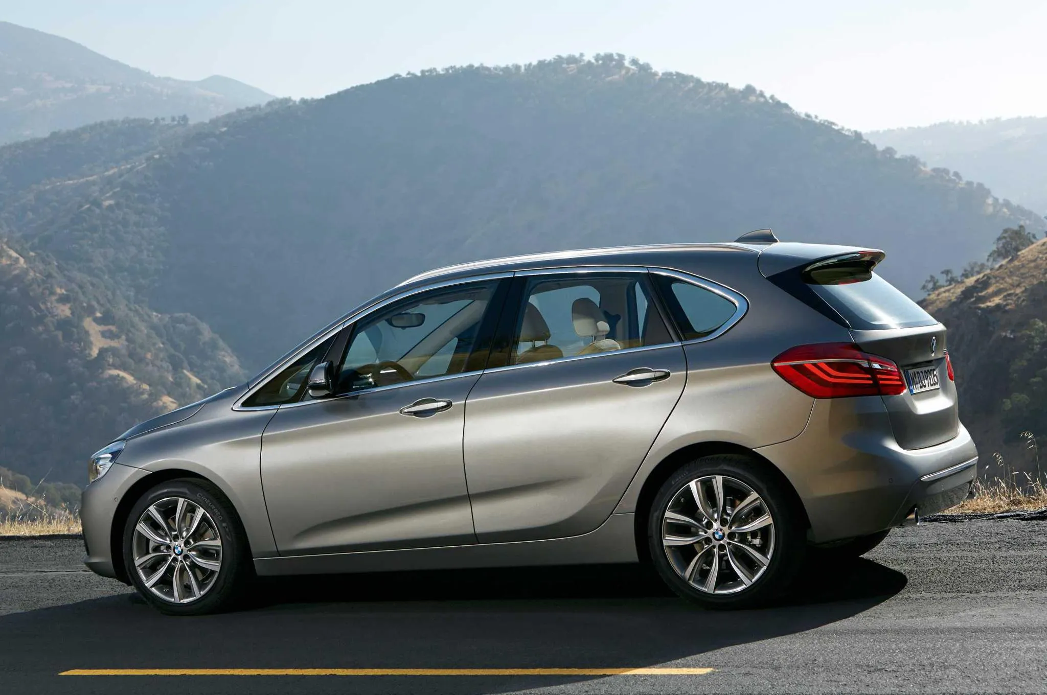 Side View of Bmw Hatchback on a Mountain Road