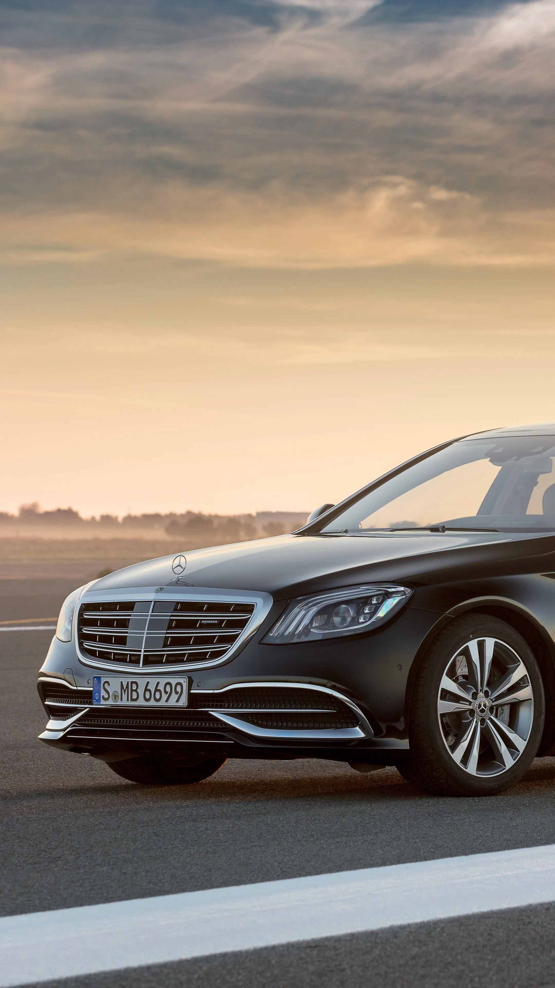 Side View of Luxury Mercedes Benz Sedan at Sunset Wallpaper