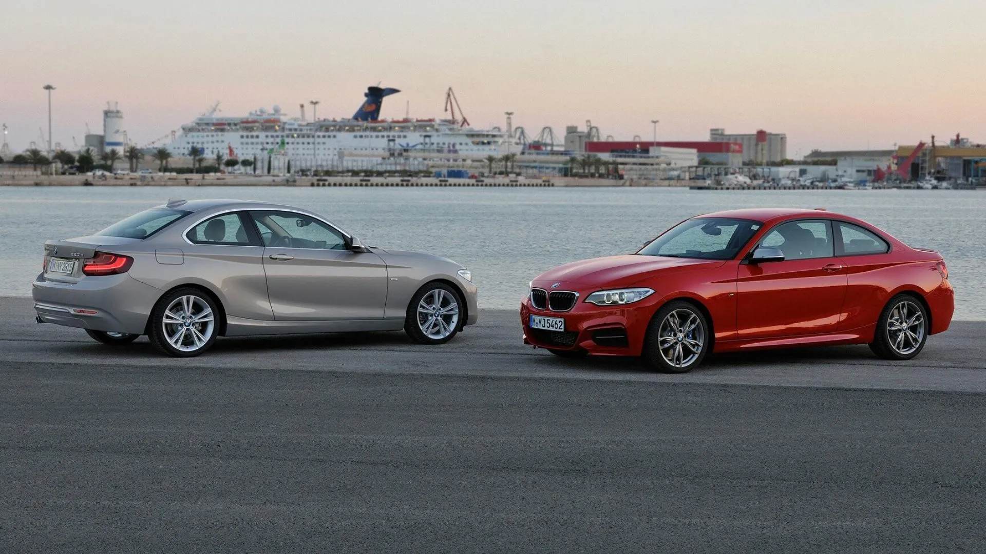 Side View of Two Bmw Sedans in an Open Parking Lot
