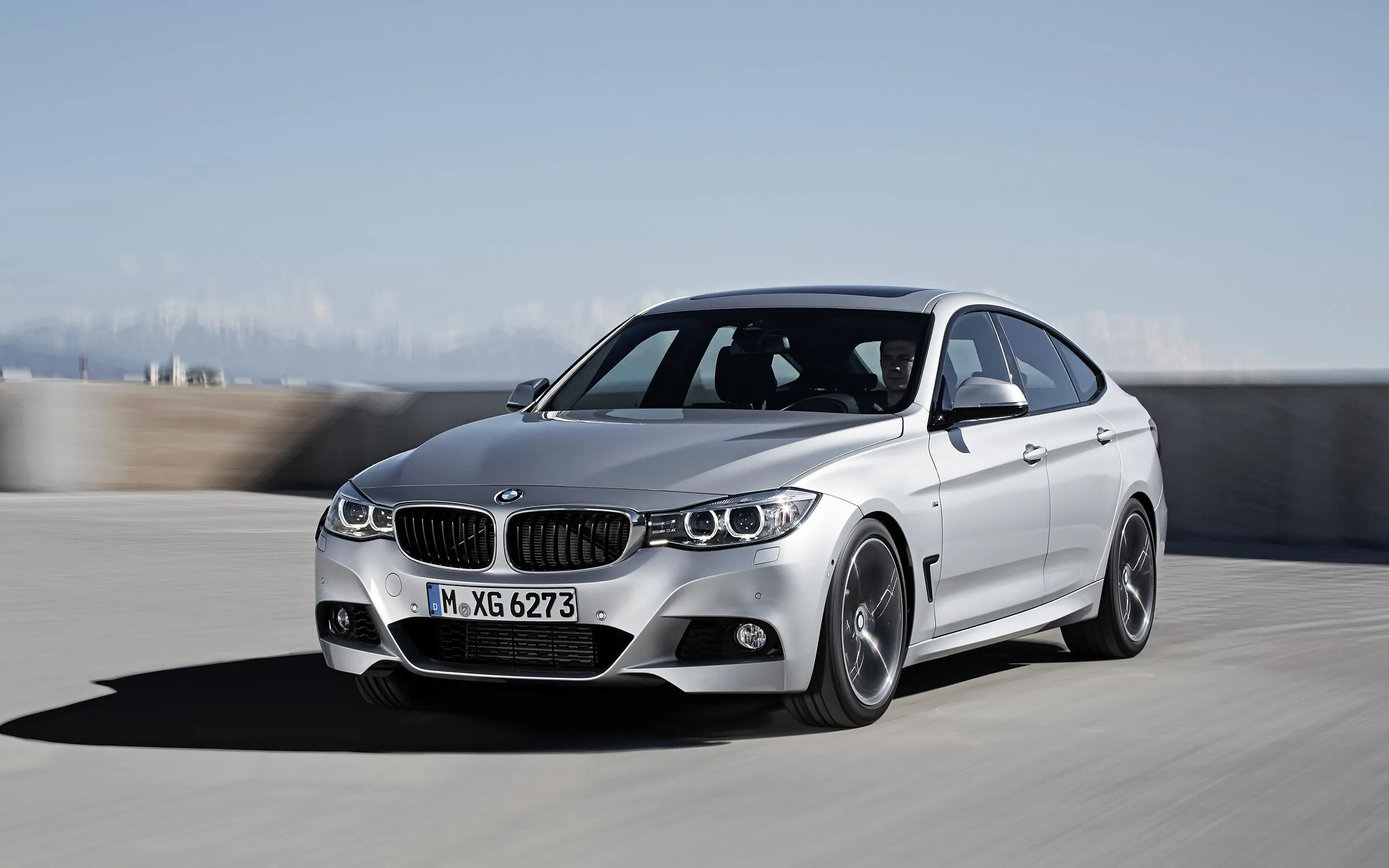 Silver Bmw Coupe on Empty Highway Under Blue Sky Image