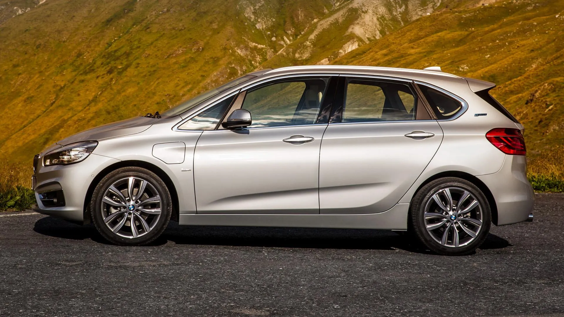 Silver Bmw Hatchback Parked Near Autumn Hills Wallpaper