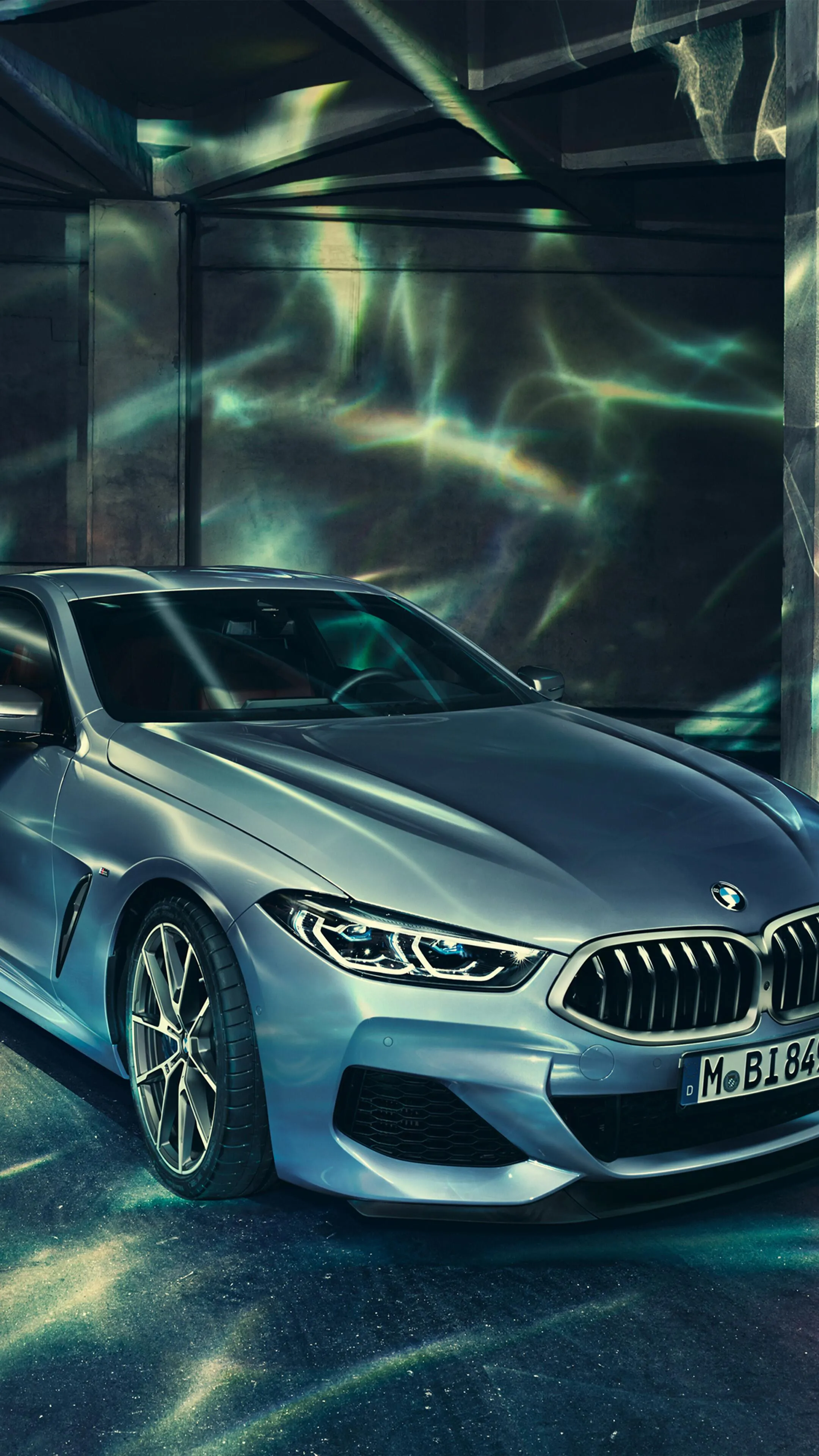 Silver Bmw in Neon Lit Tunnel with Futuristic Lighting