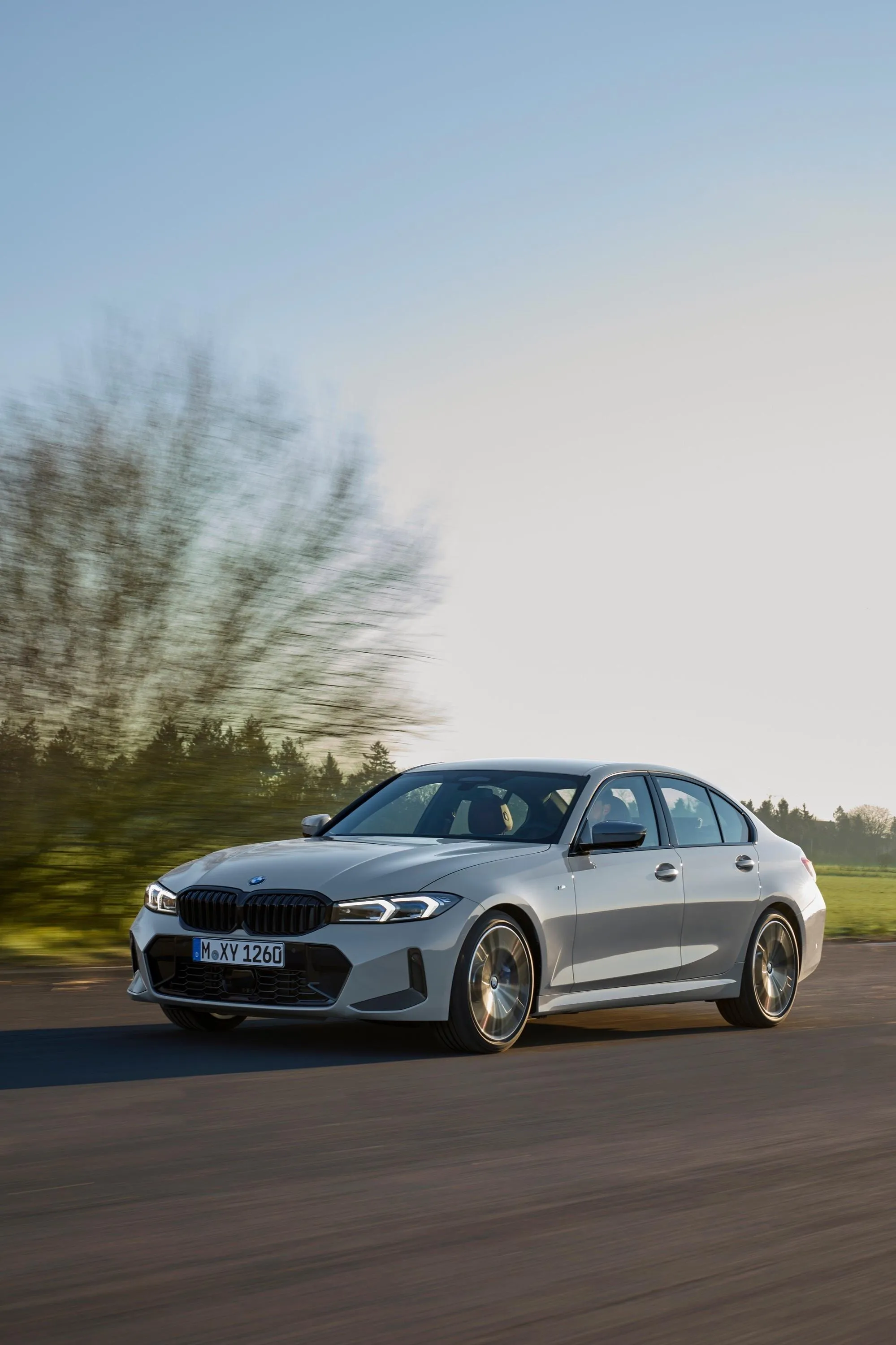 Silver Bmw on Open Road Surrounded By Greenery Wallpaper