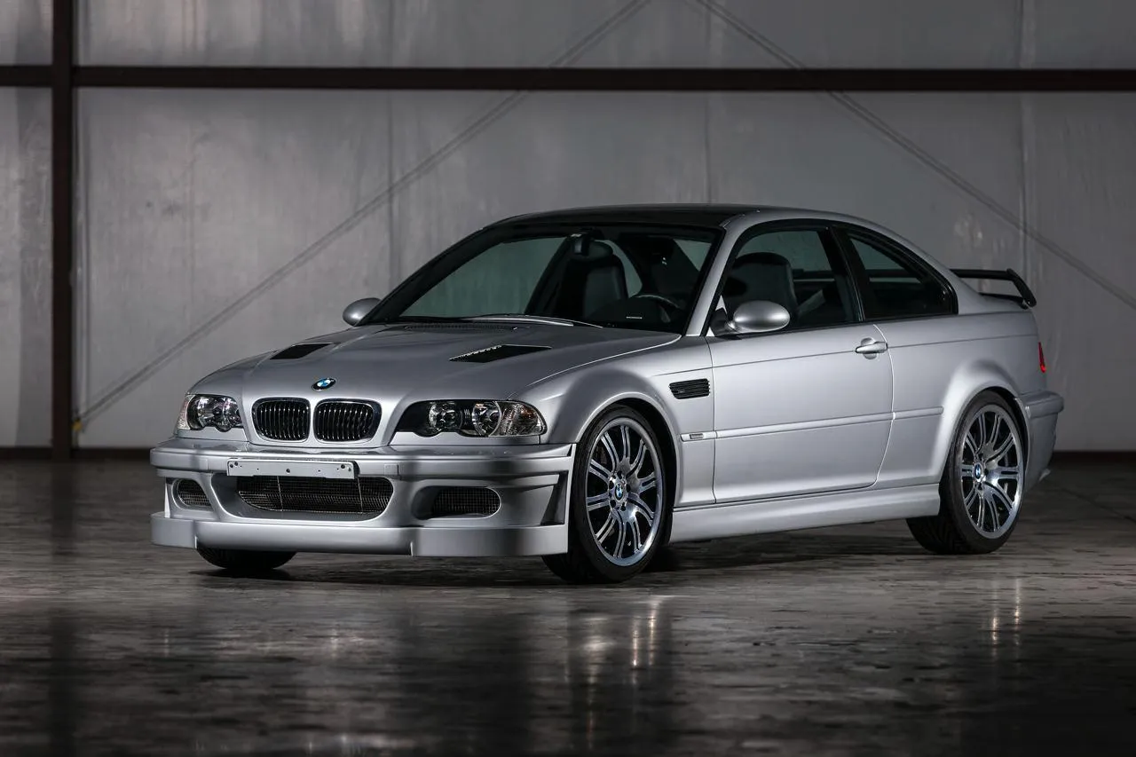 Silver Bmw Parked in Modern Garage with Clean Lighting