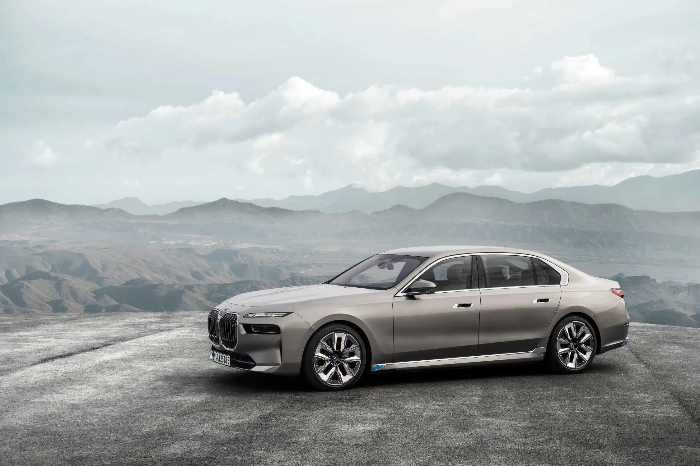 Silver Bmw Sedan Parked on a Mountain Side Road Wallpaper
