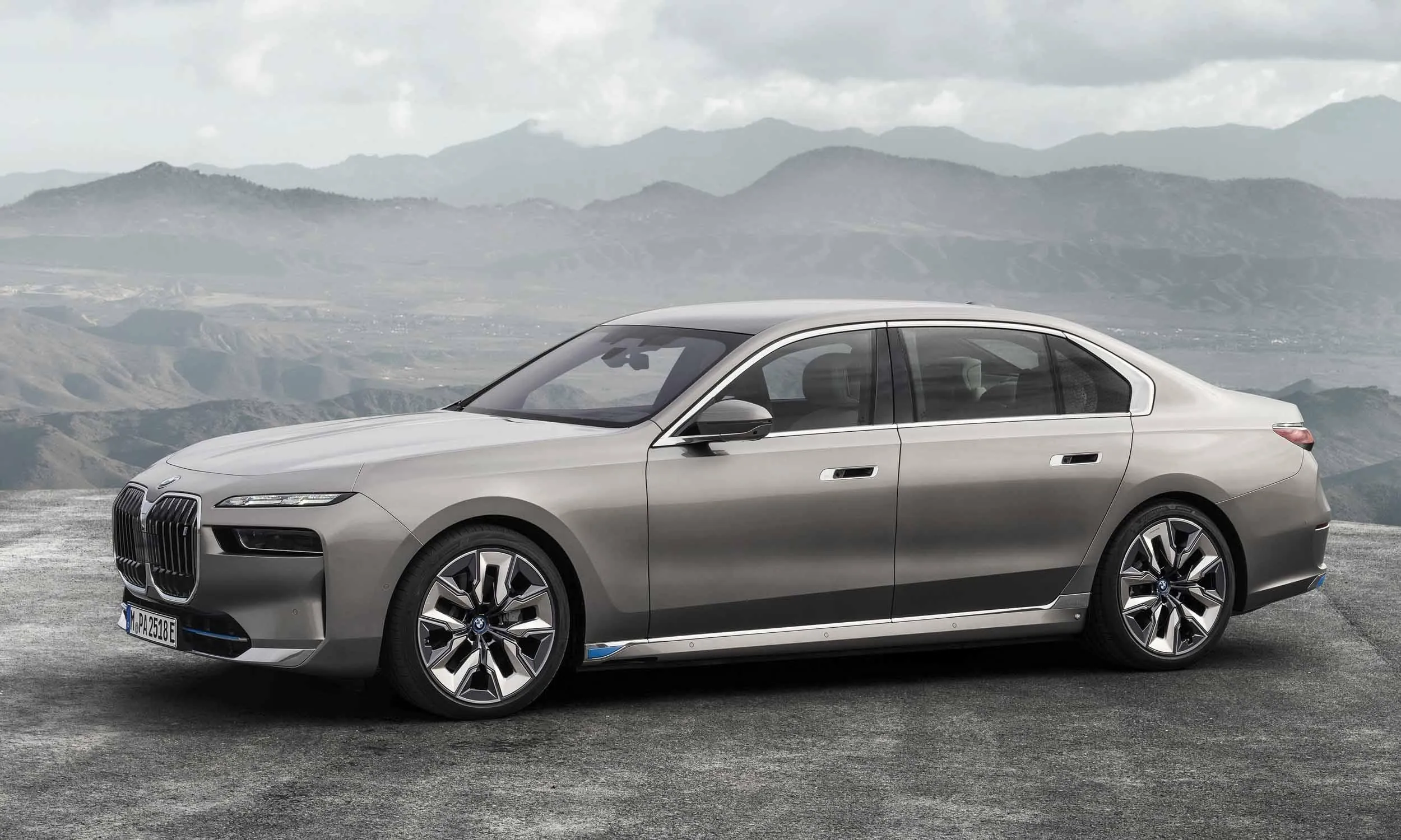 Silver Bmw Sedan Parked on a Quiet Mountain Road Image
