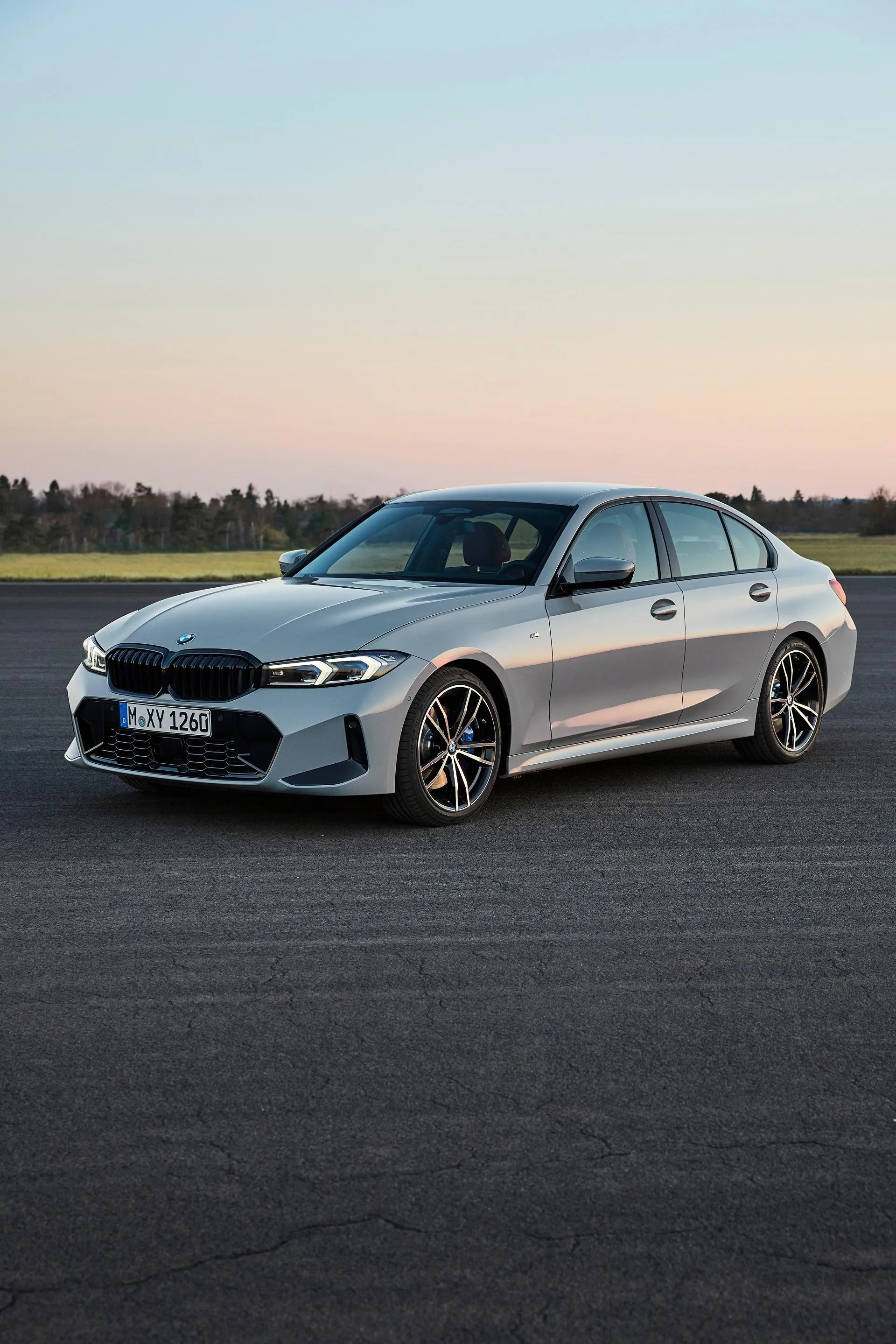 Silver Bmw Sedan Parked on Empty Asphalt Road Image