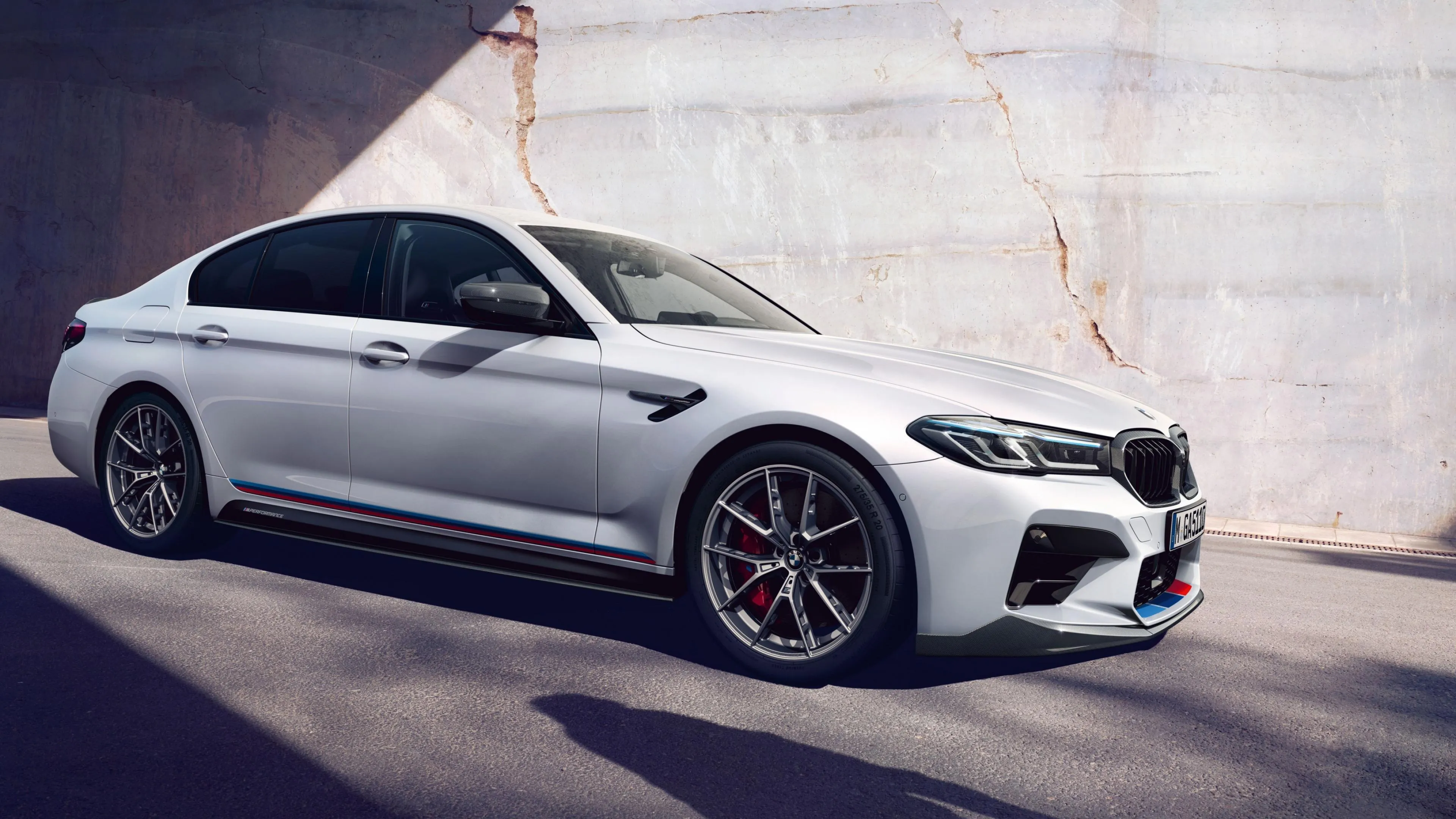 Silver Bmw Sedan Parked on White Ground with Shadows