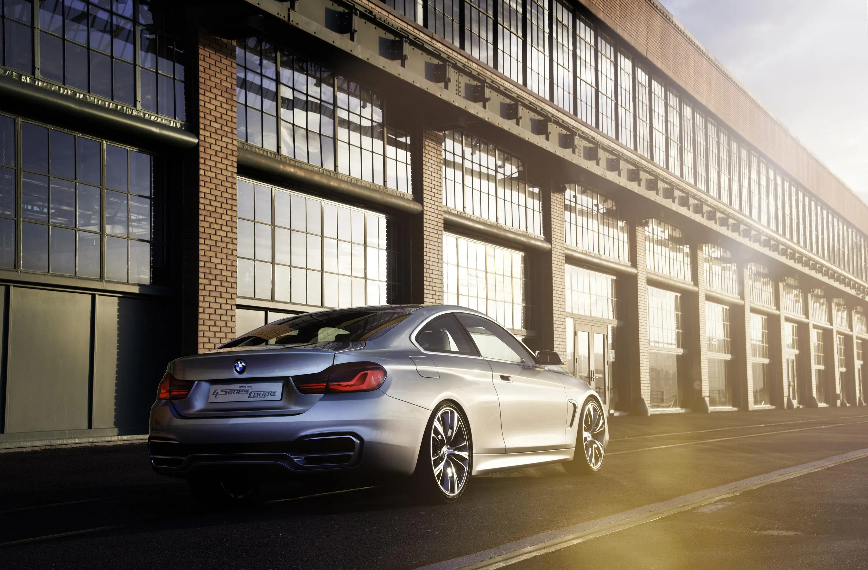 Silver Bmw Sedan Parked Outside a Modern Industrial Building