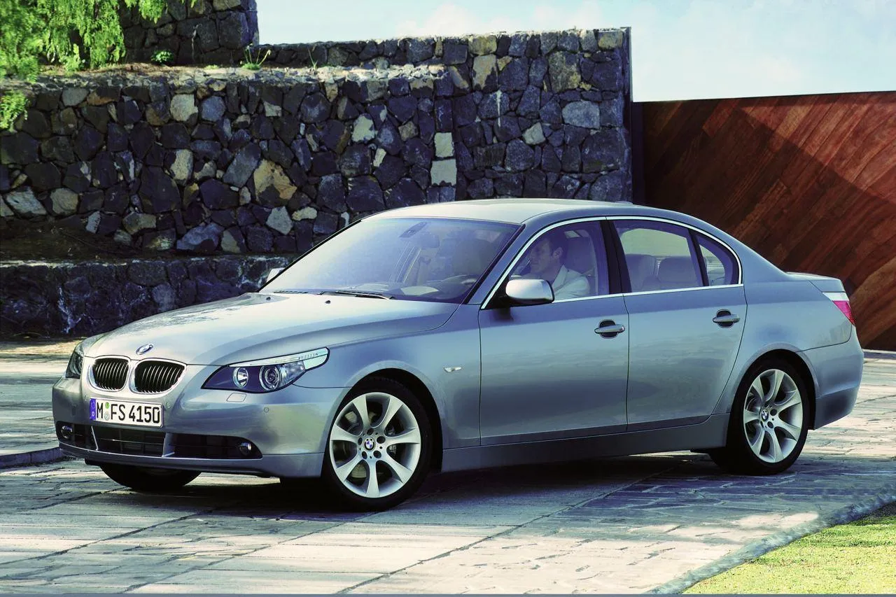 Silver Bmw Sedan Posing in a Modern Residential Driveway