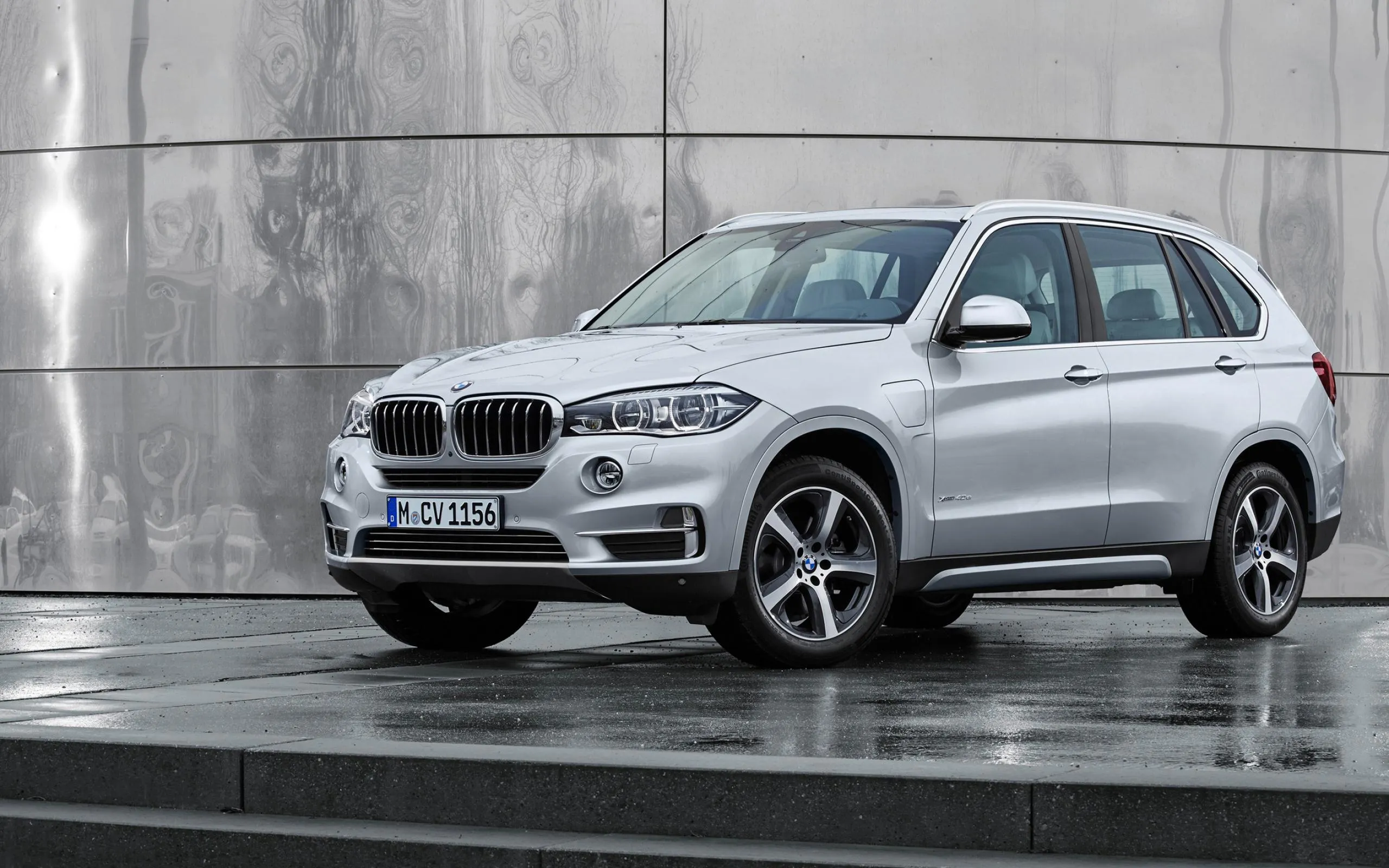 Silver Bmw Suv Parked Near Modern Concrete Wall Hd Image