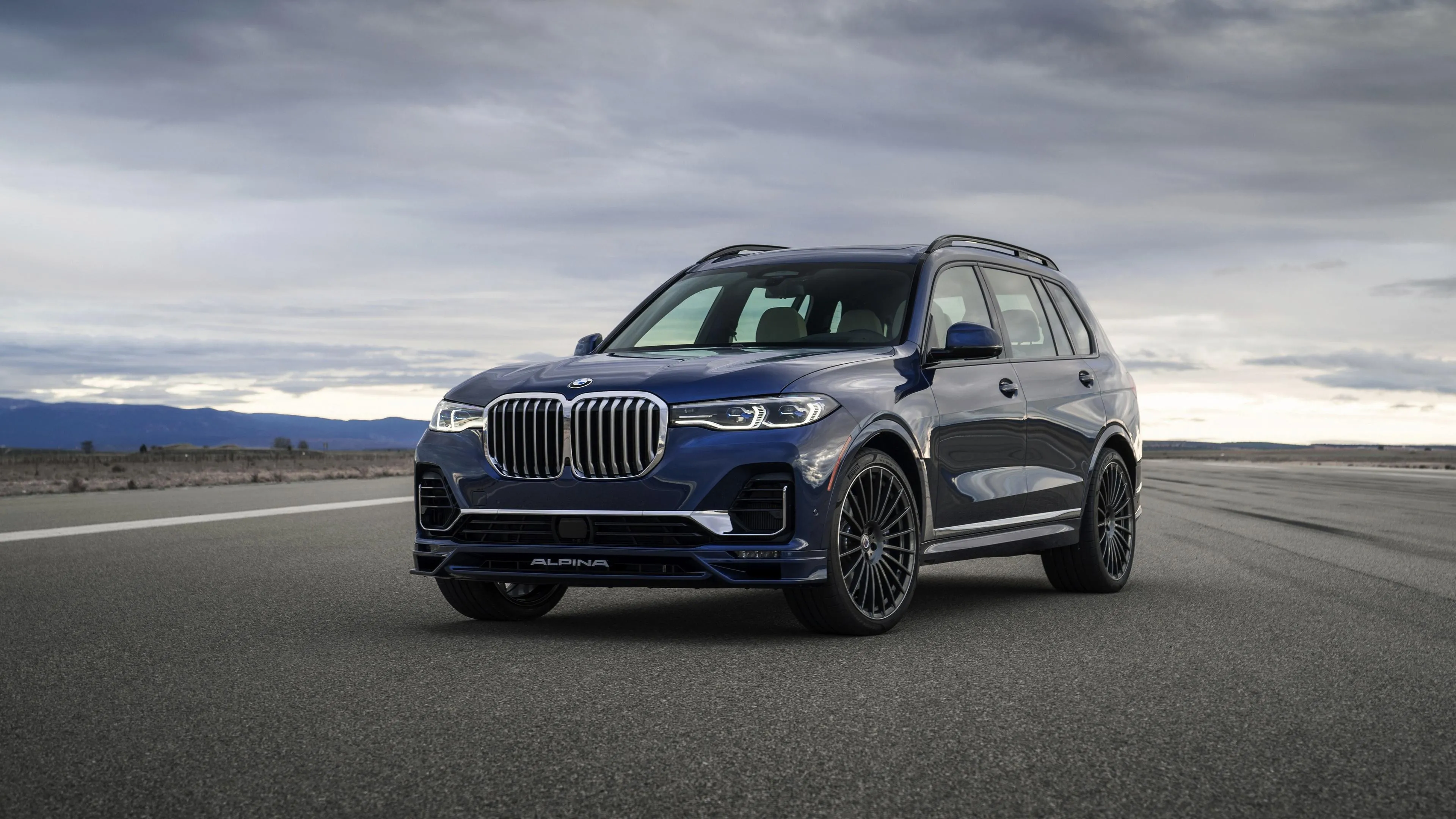 Silver Bmw Suv Parked on a Scenic Coastline View Wallpaper