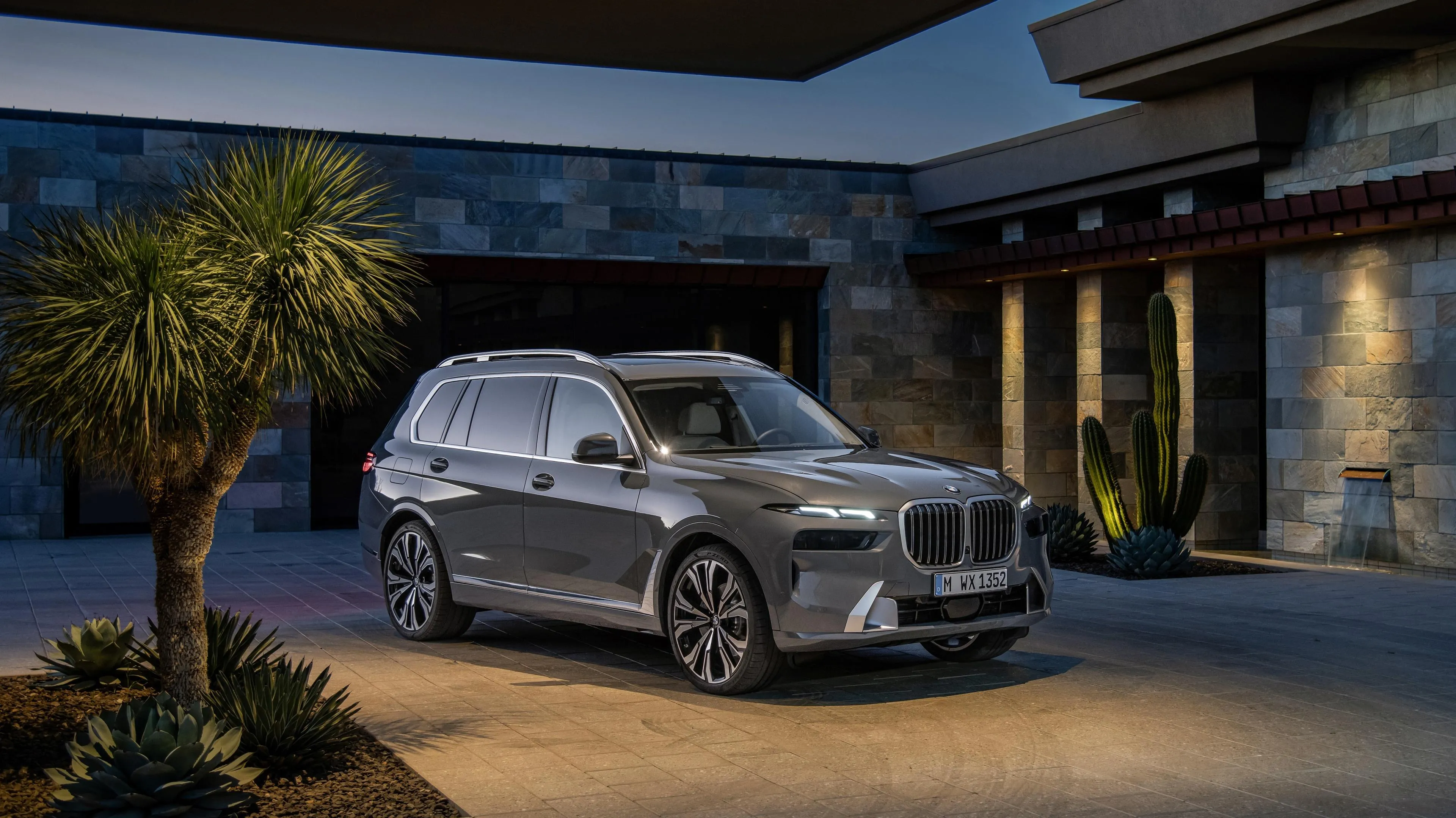 Silver Bmw Suv Parked Outside a Modern Luxury House