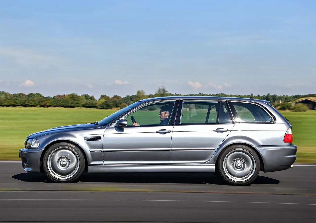 Silver Bmw Touring Car Parked on Grass Beside Track