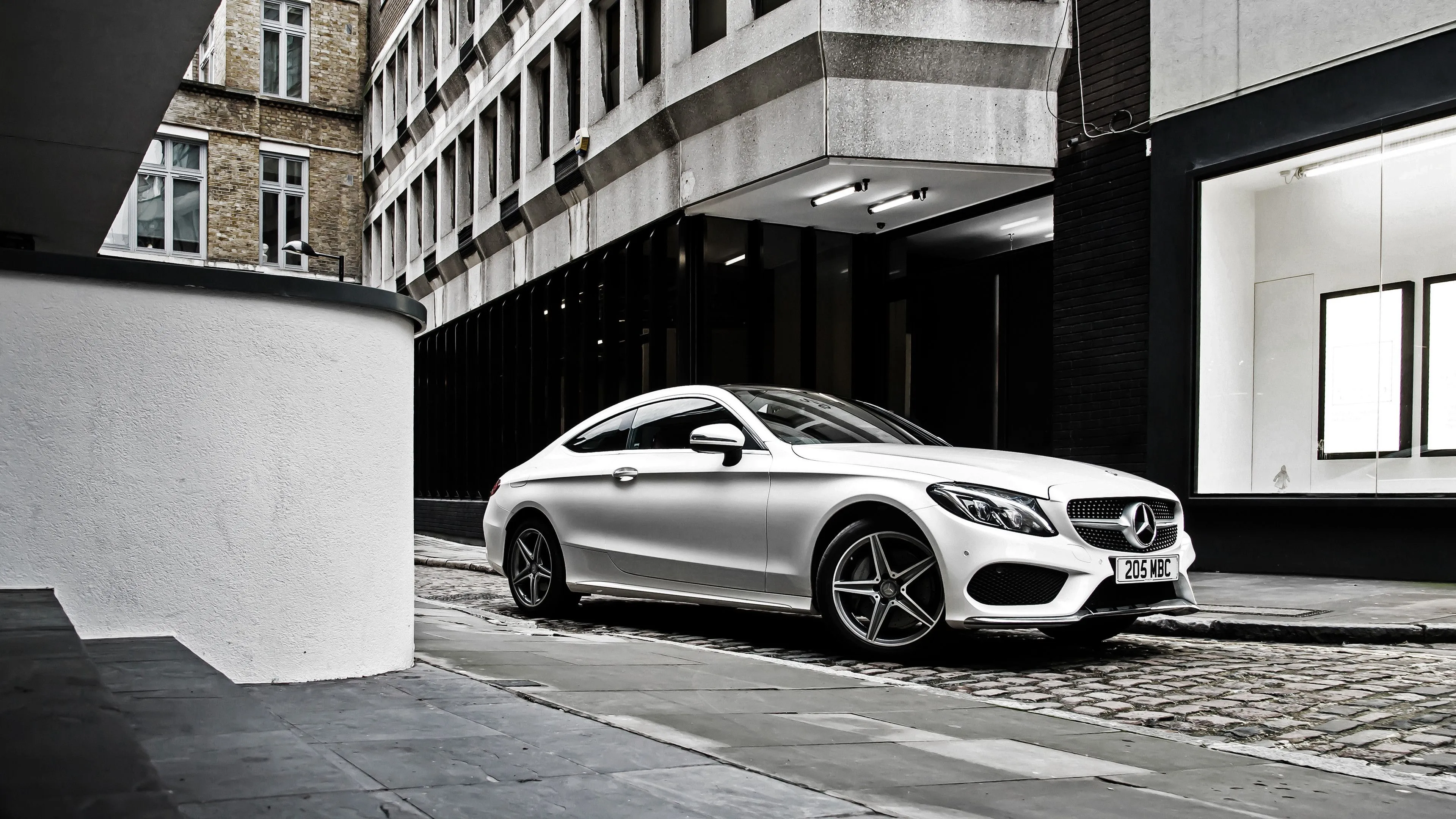 Silver Mercedes Benz Coupe Parked in Urban Environment