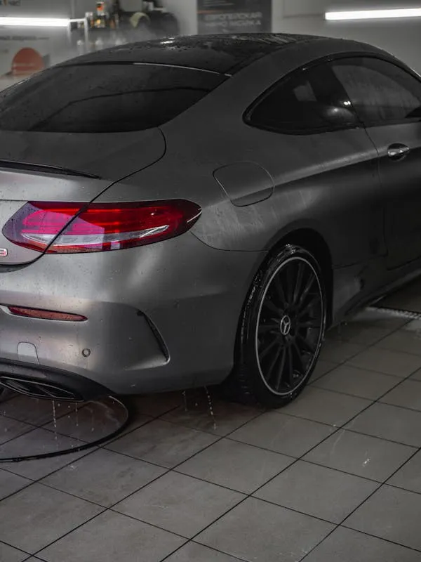 Silver Mercedes Benz Coupe Parked Indoors Garage Wallpaper