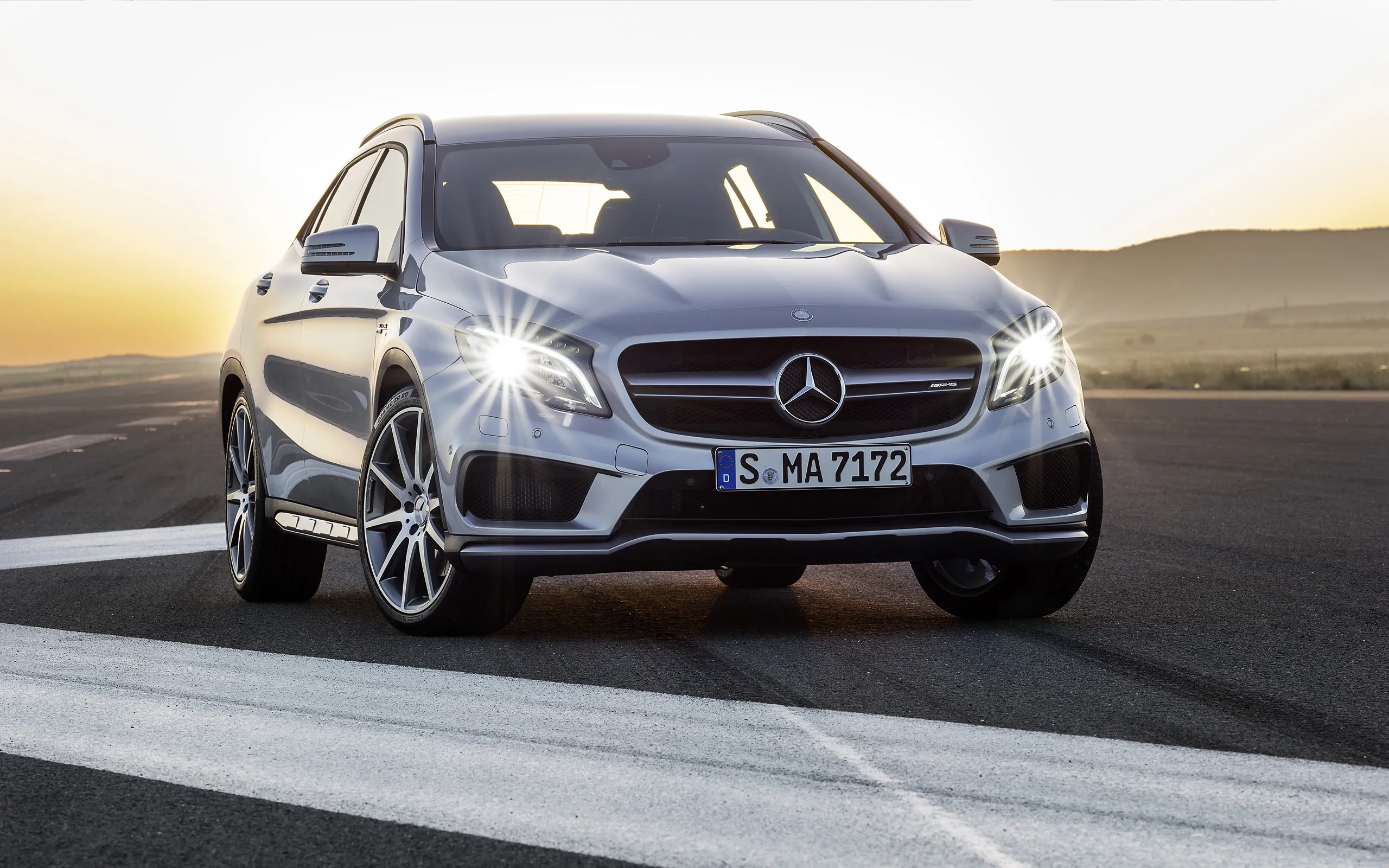 Silver Mercedes Benz Driving Fast on Coastal Highway