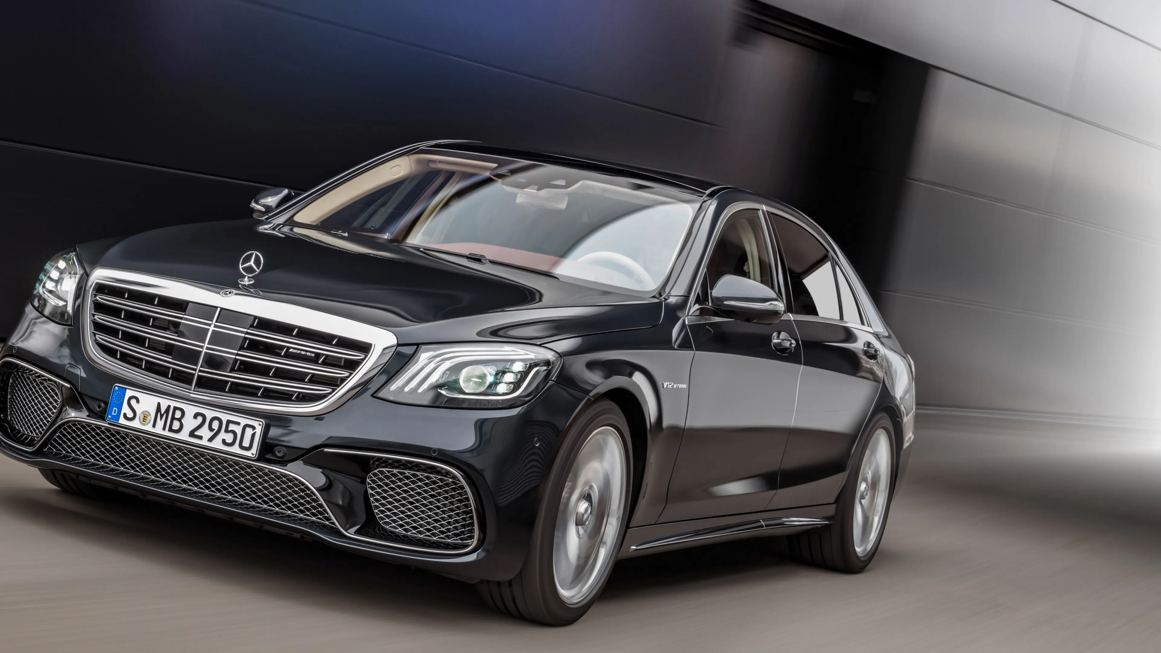 Silver Mercedes Benz Sedan Driving Fast in Urban Setting