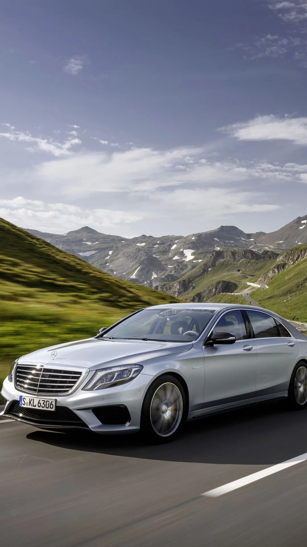 Silver Mercedes Benz Sedan Driving Through Mountain Road