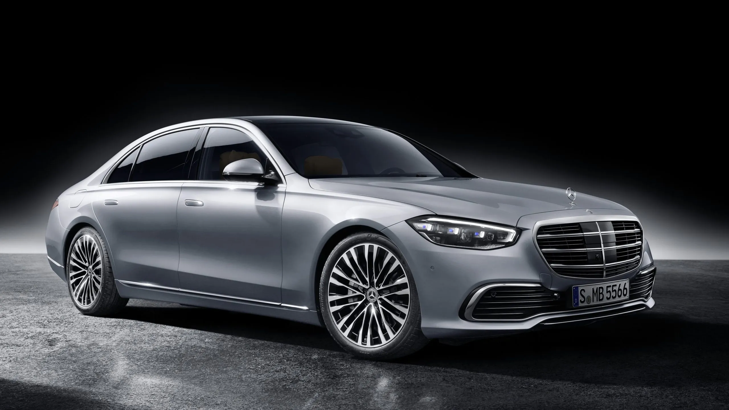 Silver Mercedes Benz Sedan in Studio with Black Background