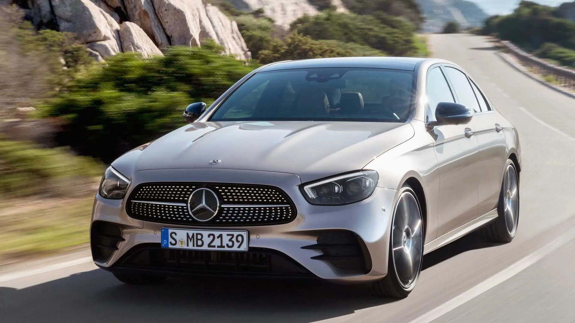 Silver Mercedes Benz SUV Driving on Smooth Road with nature