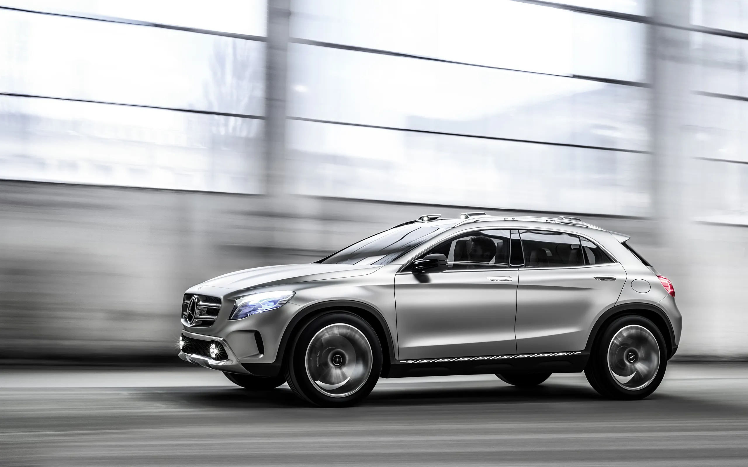 Silver Mercedes Benz SUV Moving Quickly Inside Modern Building