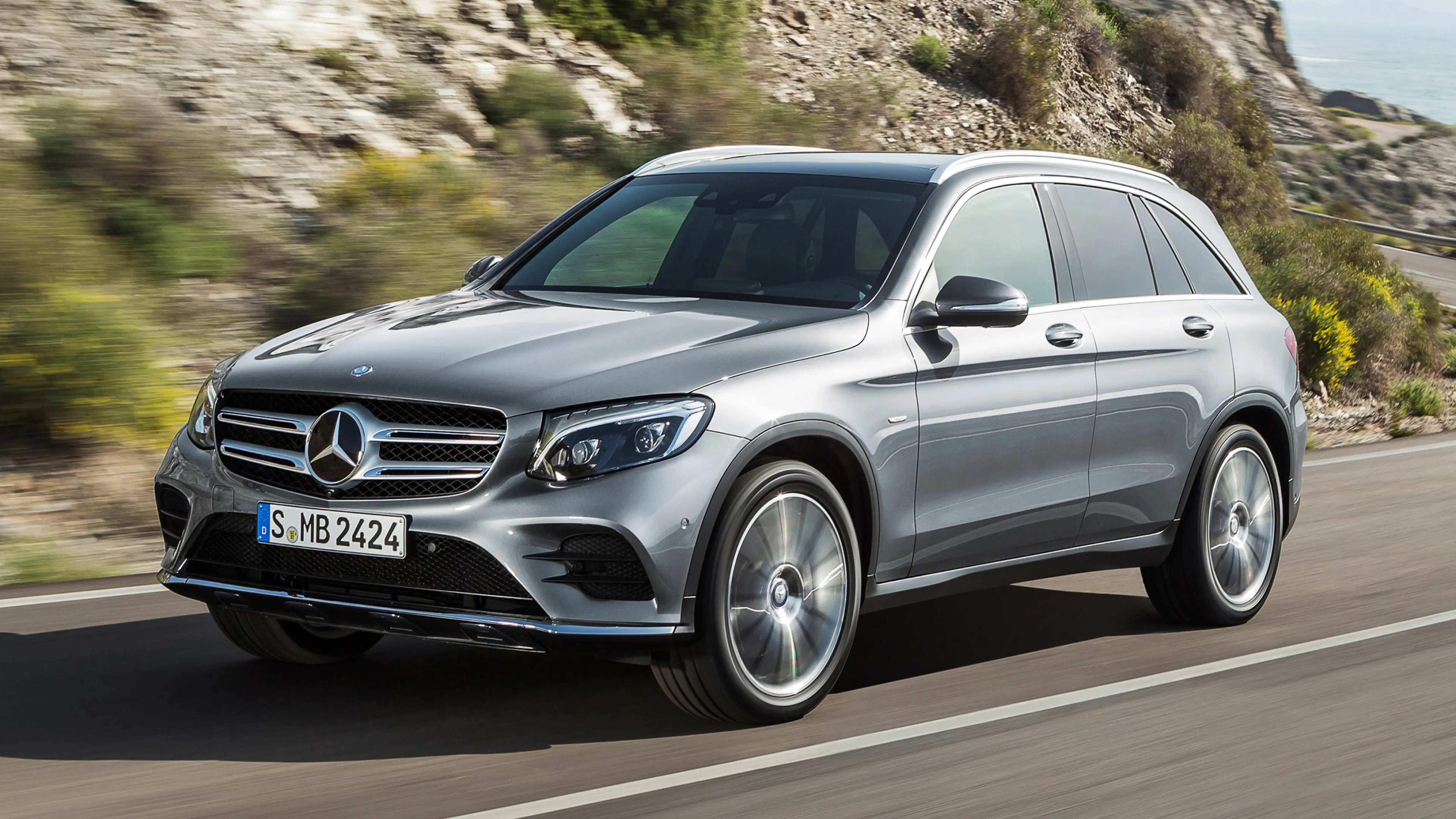 Silver Mercedes Benz SUV Moving Through Mountain Roads