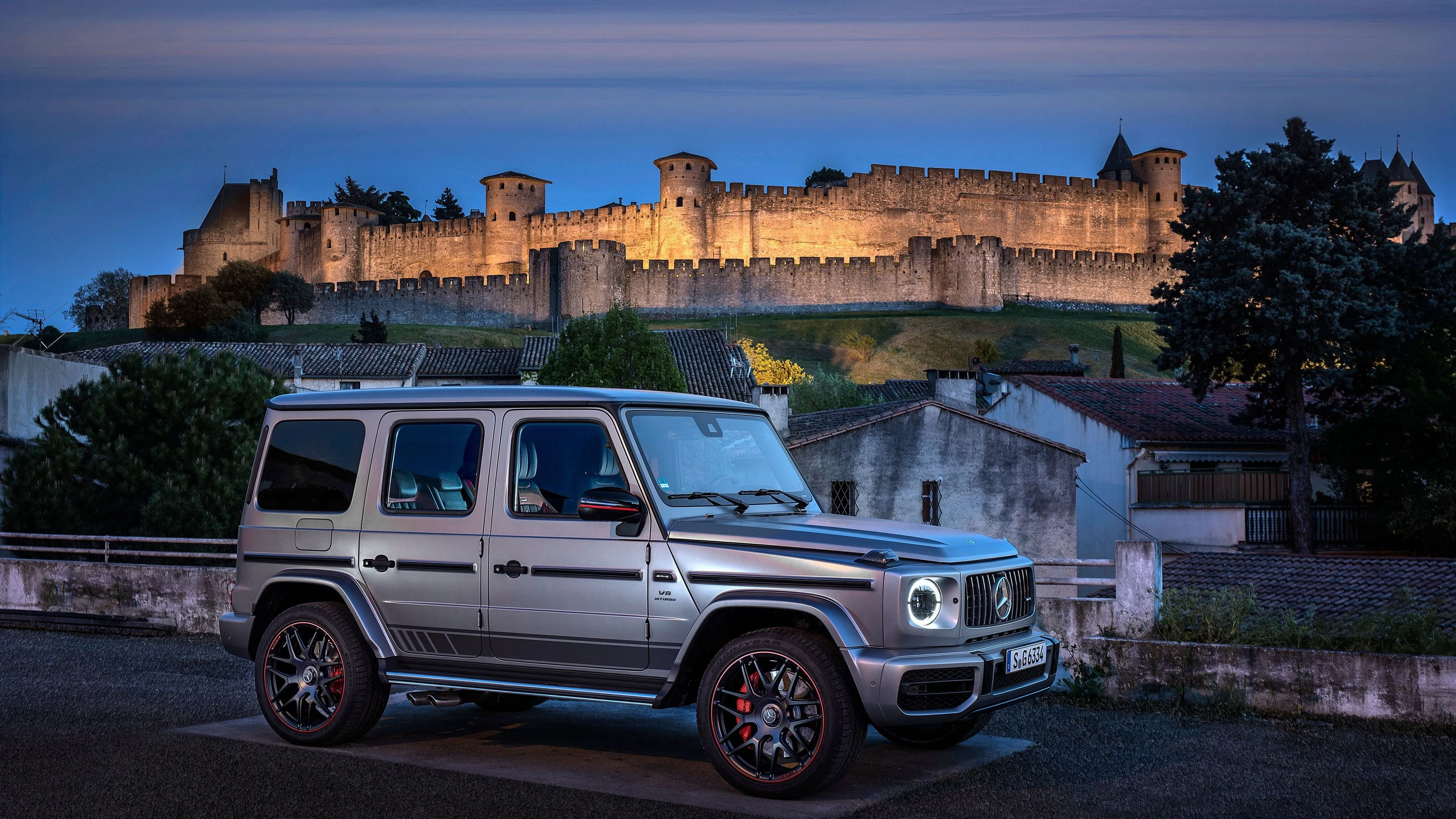 Silver Mercedes Benz SUV Parked Near Old Castle Wallpaper
