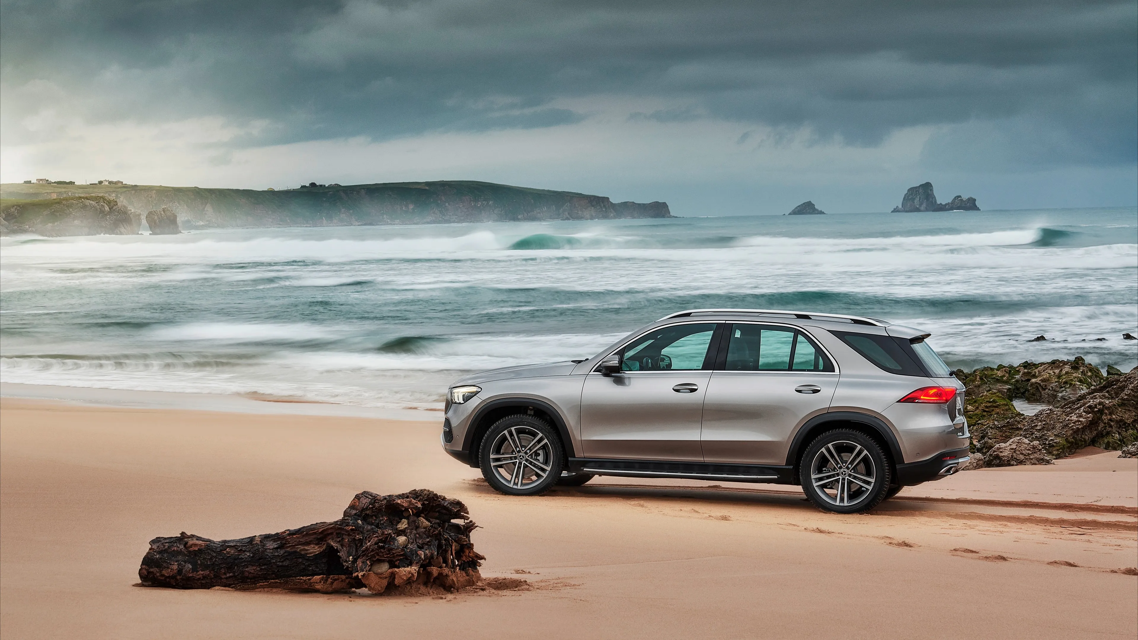 Silver Mercedes Benz SUV Parked on Sandy Beach Shore HD