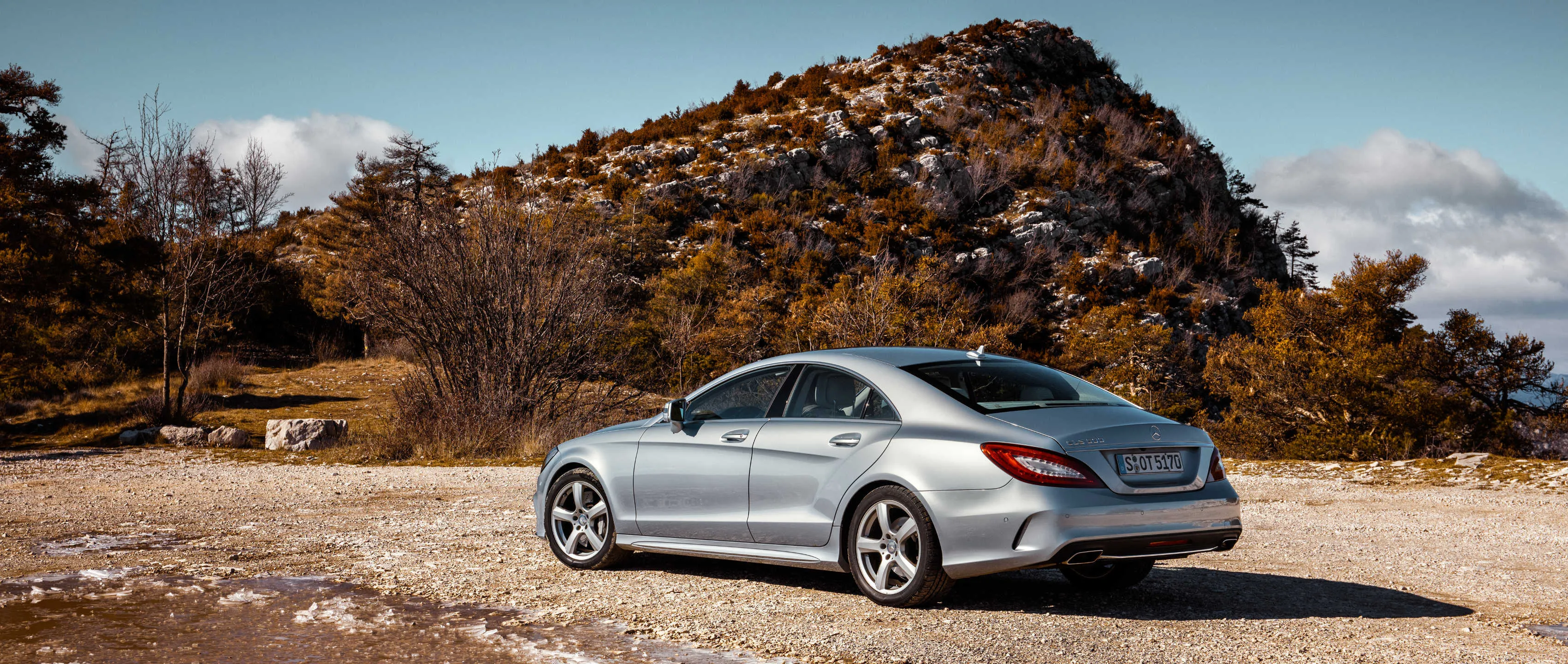 Silver Mercedes Coupe Parked in Fall Mountain Landscape