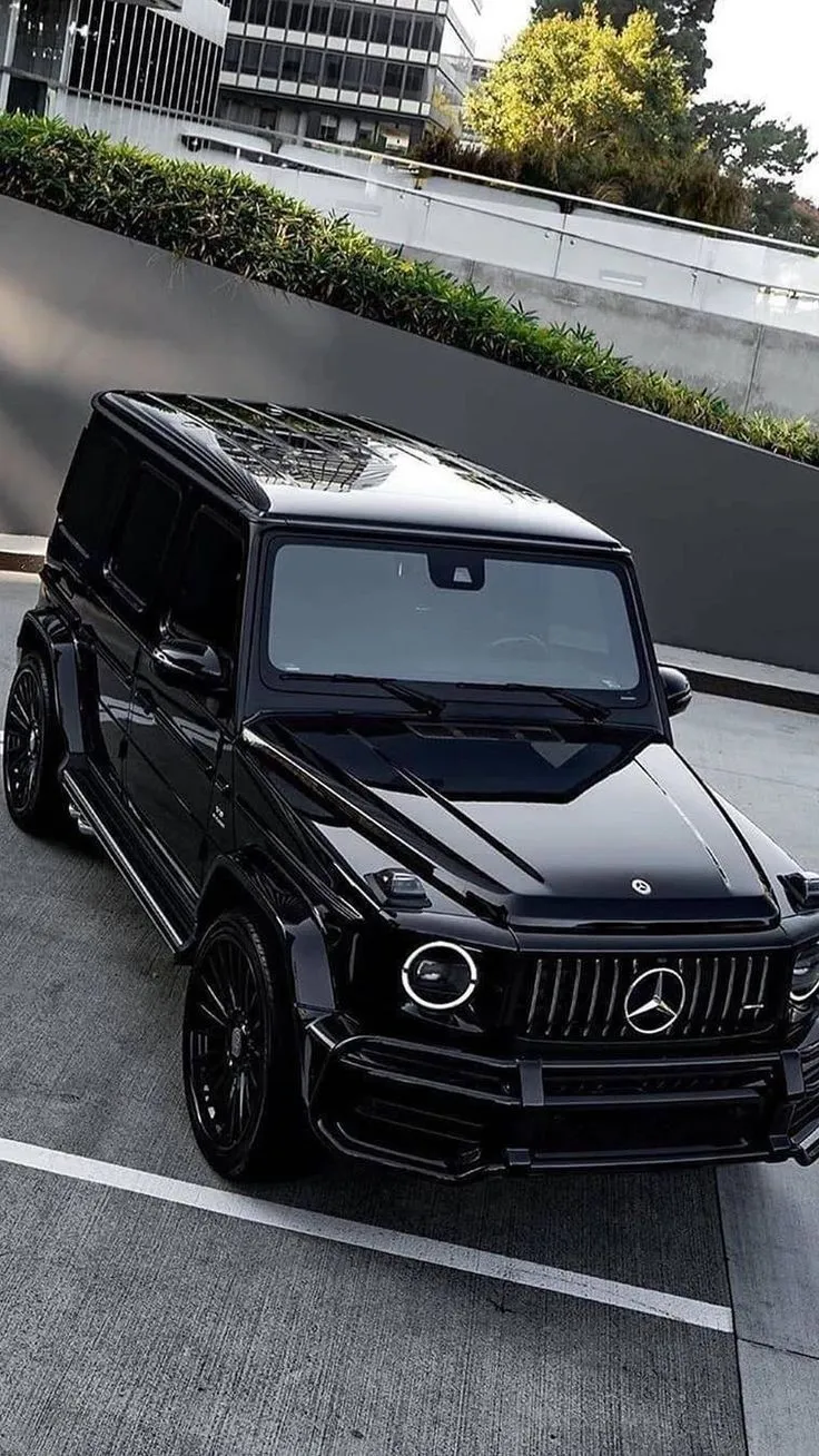 Sleek Black Mercedes G Wagon Parked on Modern Street