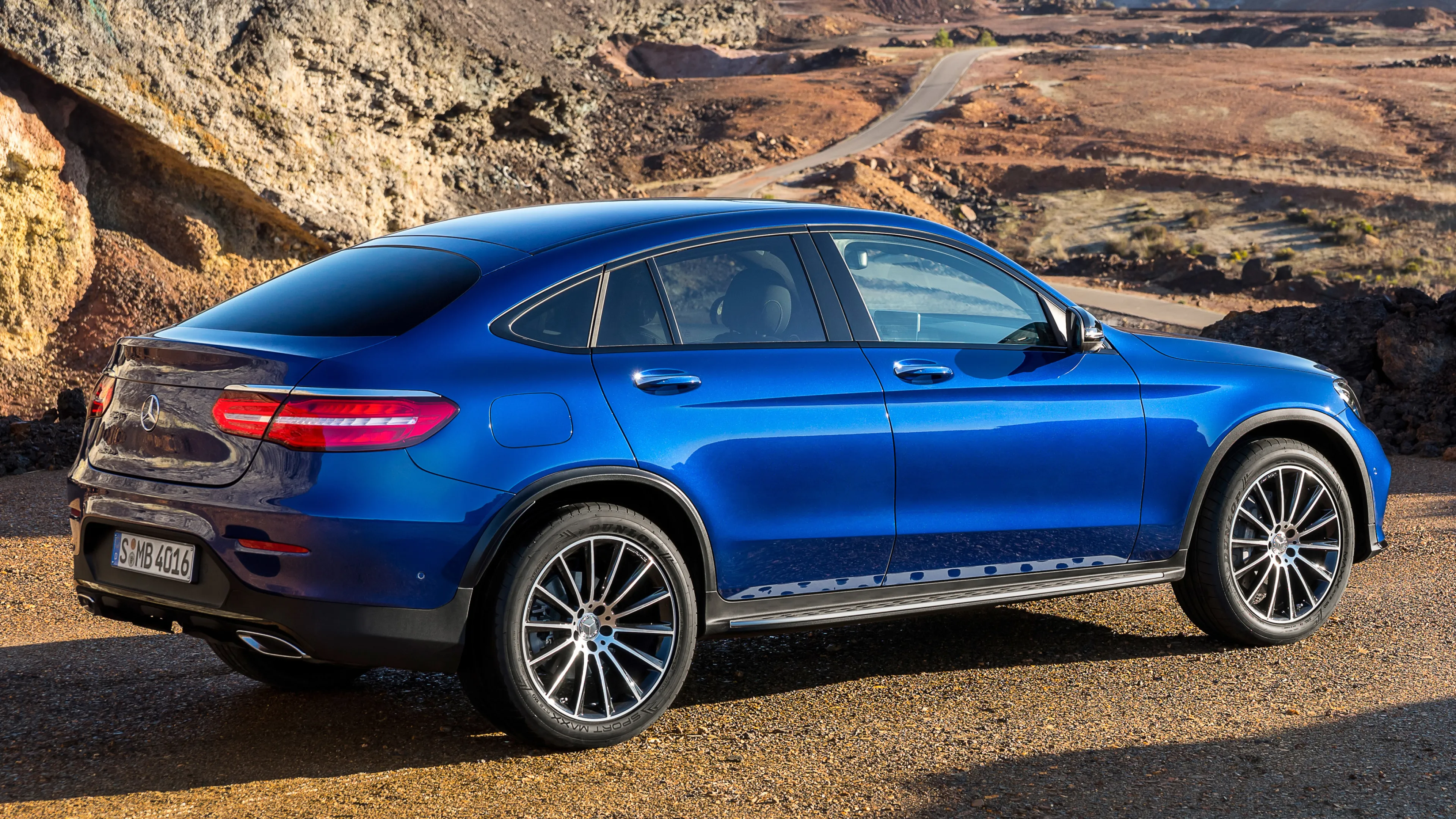 Sleek Blue Mercedes Benz SUV on a Rugged Terrain Wallpaper
