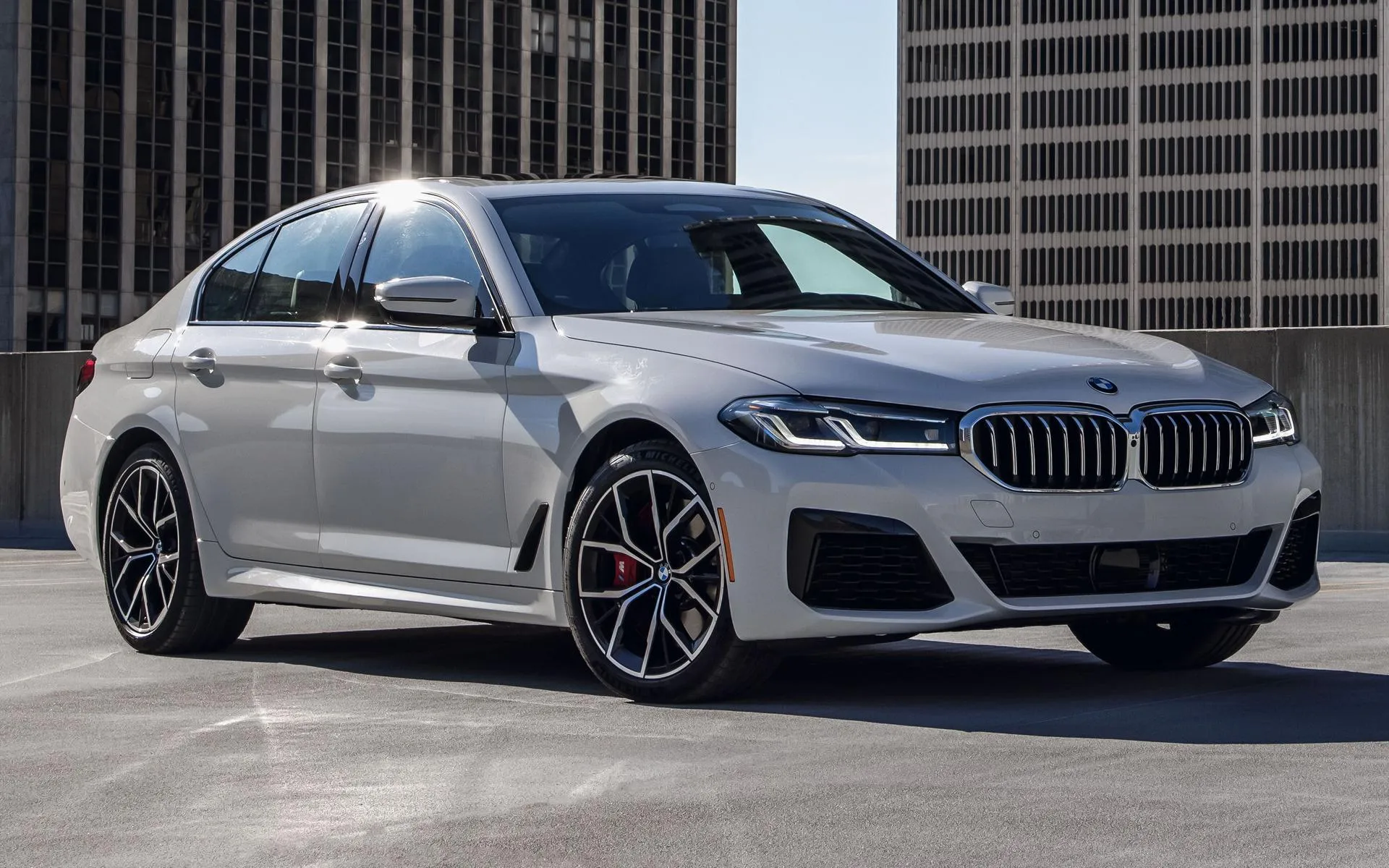 Sleek Bmw Sedan in Urban Setting with Modern Design