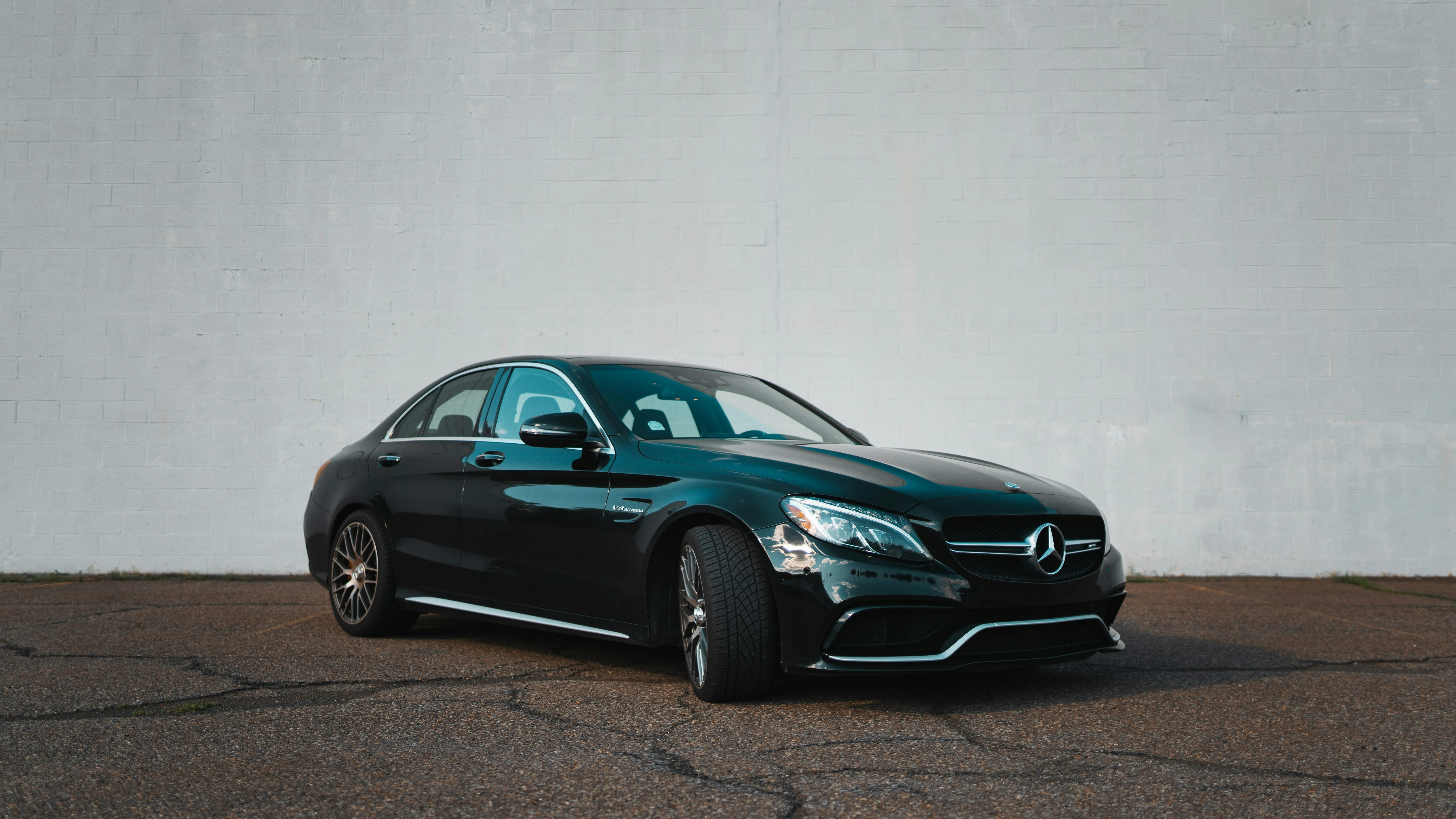 Sleek Mercedes Benz Car Parked Against a Plain Wall