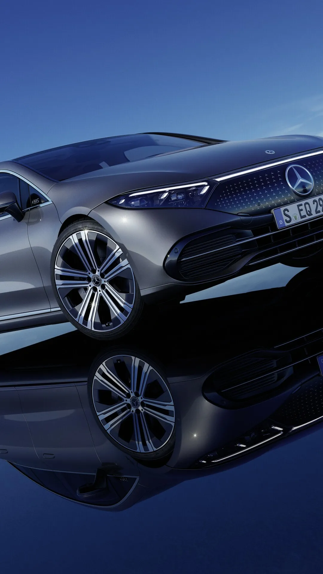 Sleek Mercedes Reflected on Blue Glossy Surface Wallpaper
