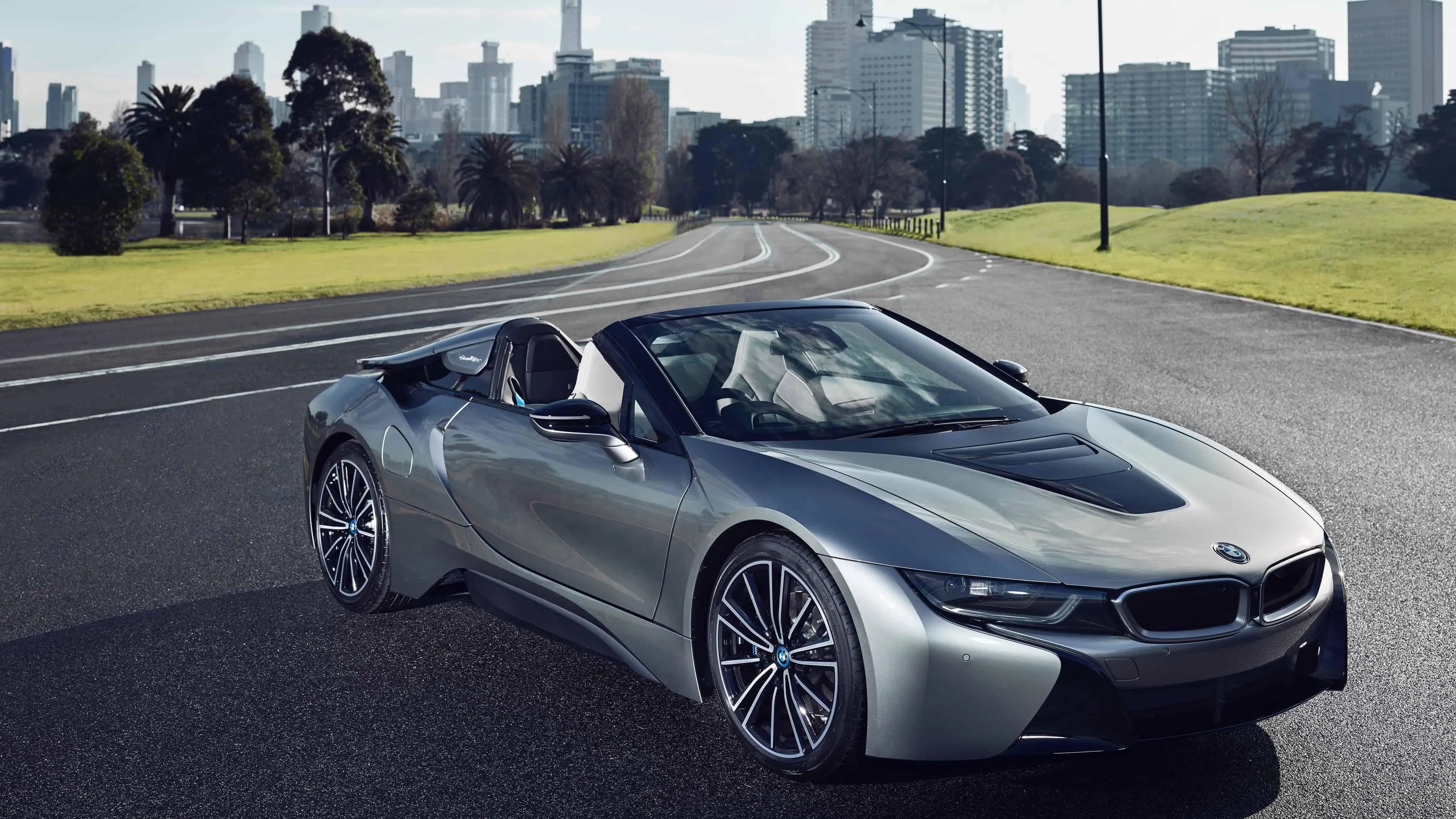 Sleek Silver Bmw Convertible in City Landscape Wallpaper