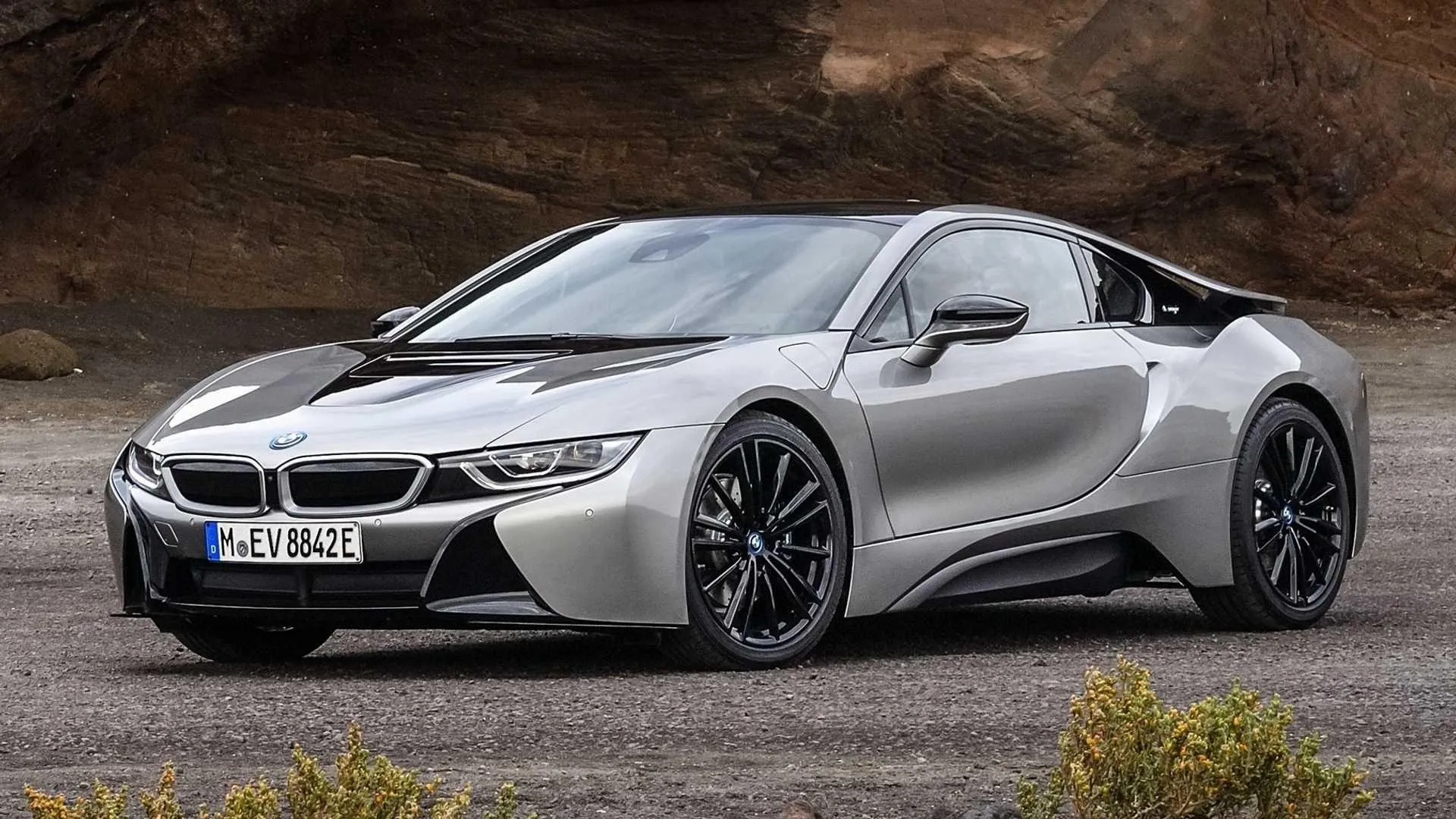 Sleek Silver Bmw Sports Car Parked on Desert Road Image