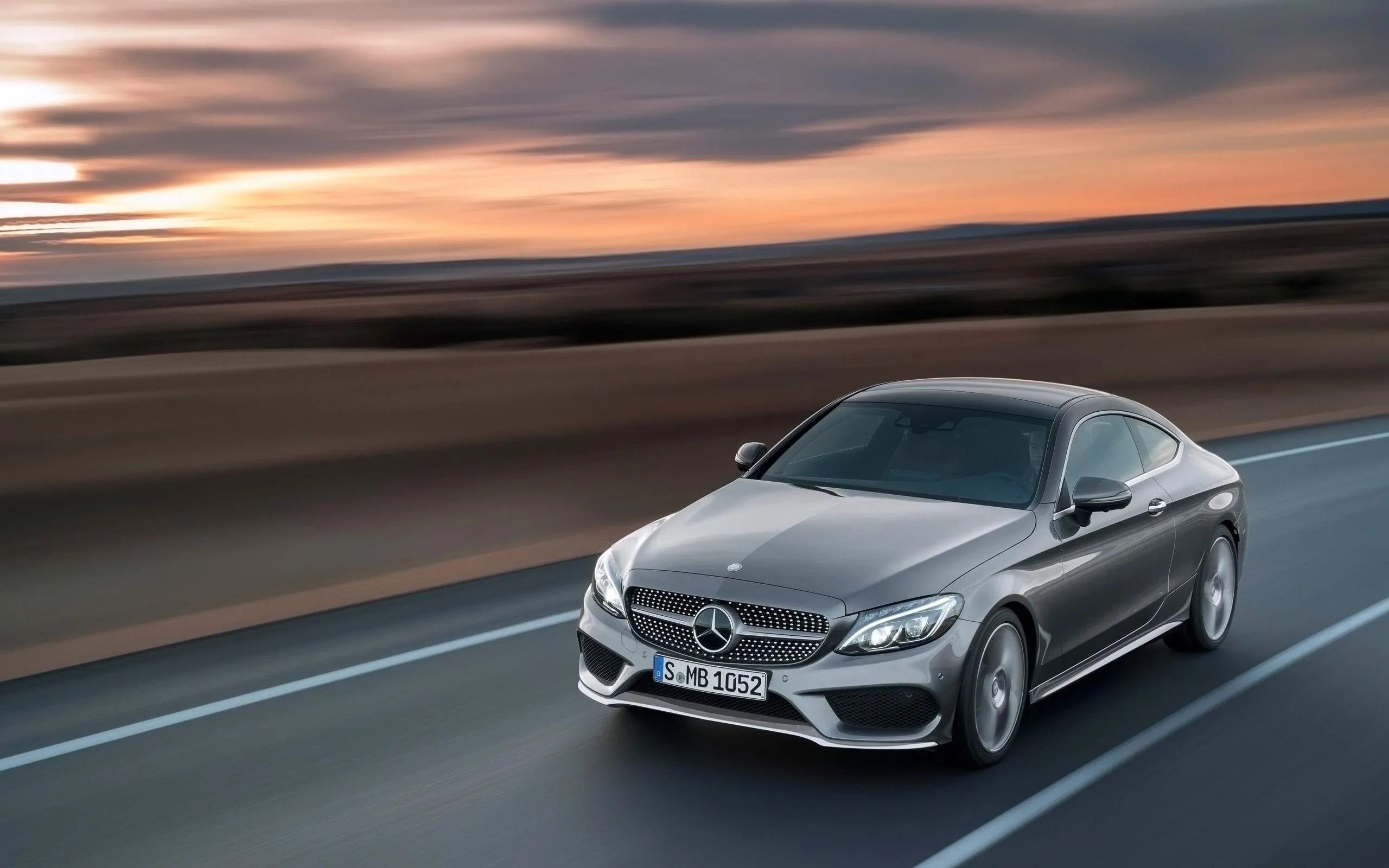 Sleek Silver Mercedes Benz Driving in Motion free 4K image