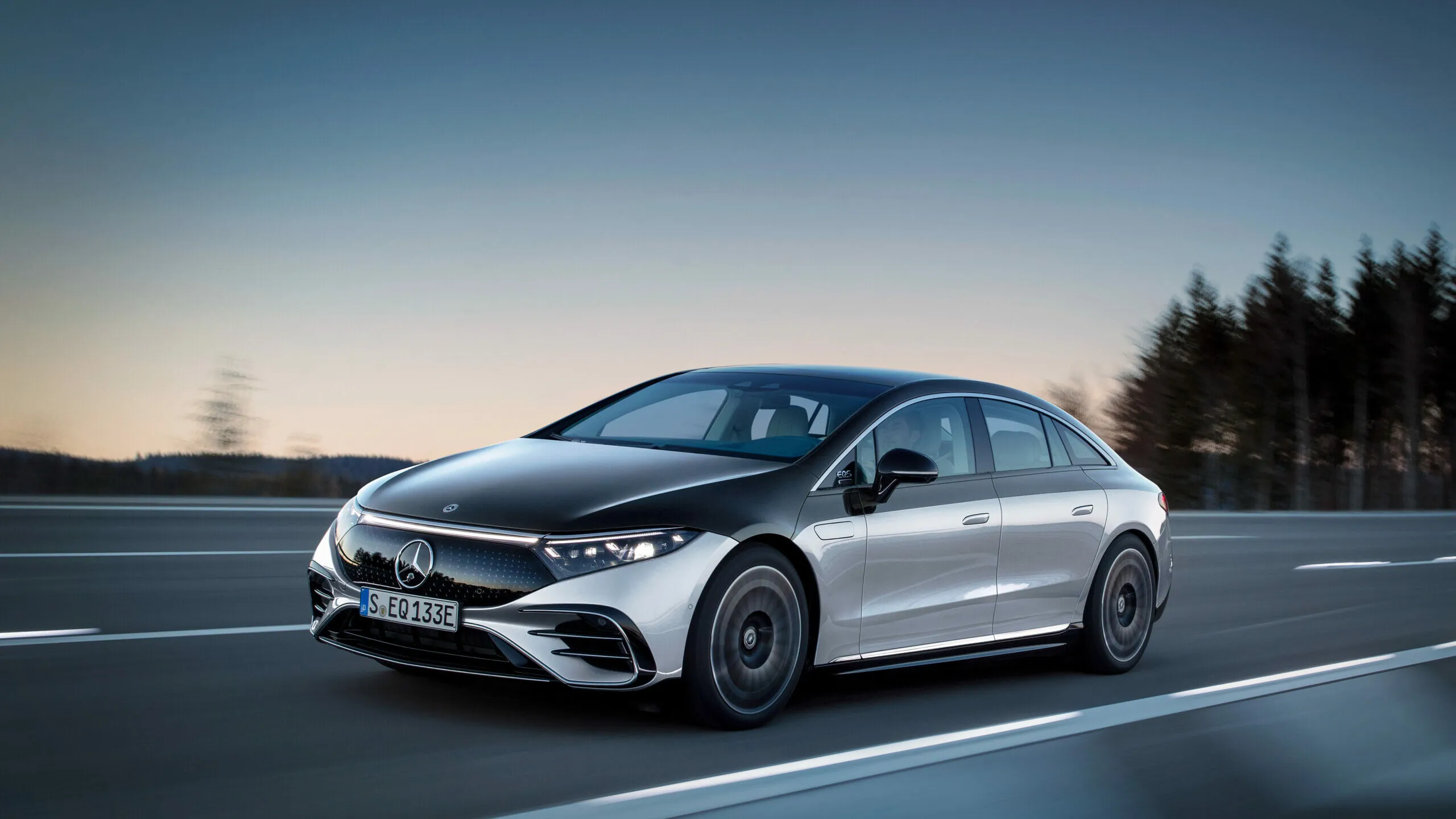Sleek Silver Mercedes Sedan on Open Country Road Wallpaper