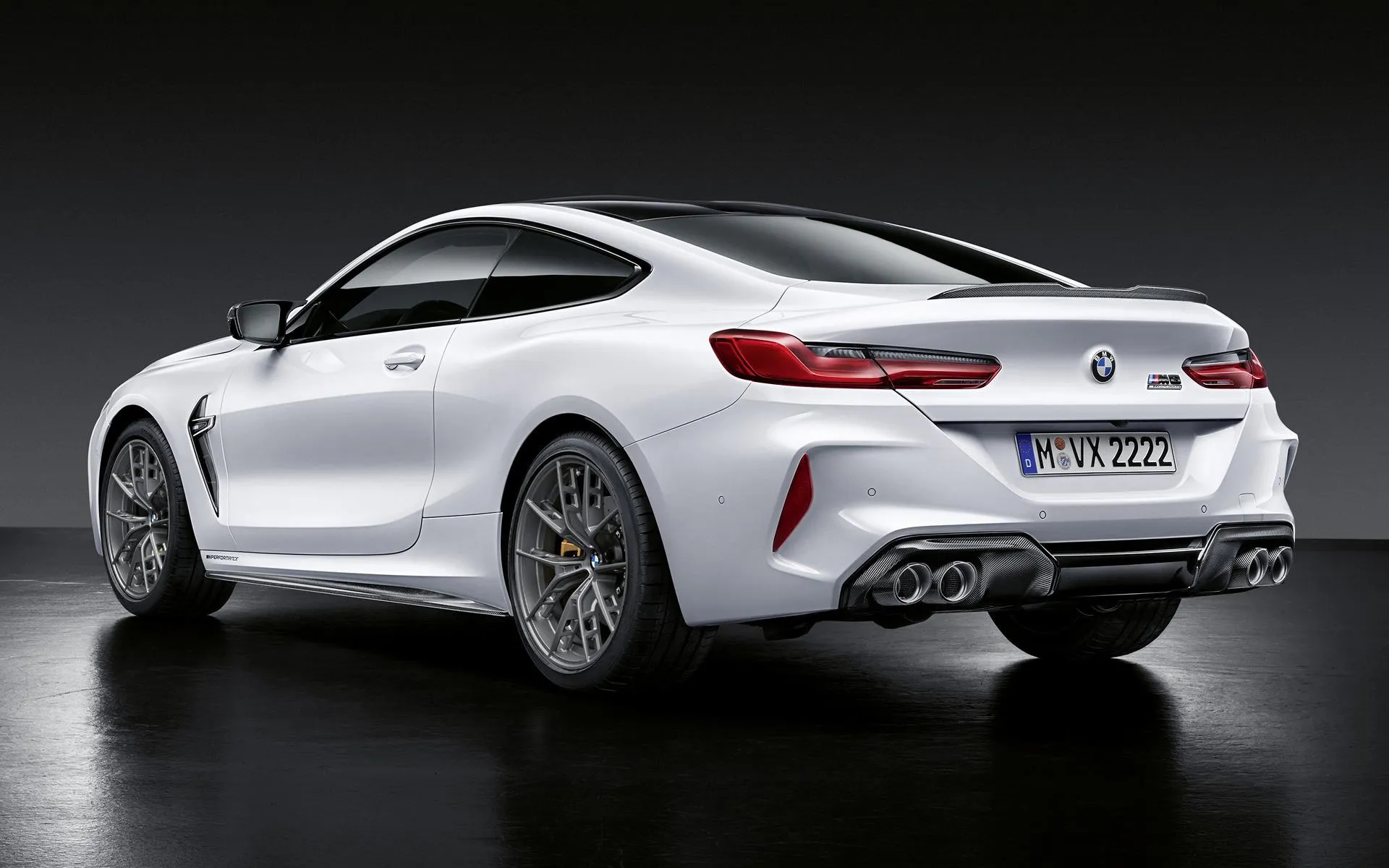 Sleek White Bmw Coupe Shown in Studio with Black Background